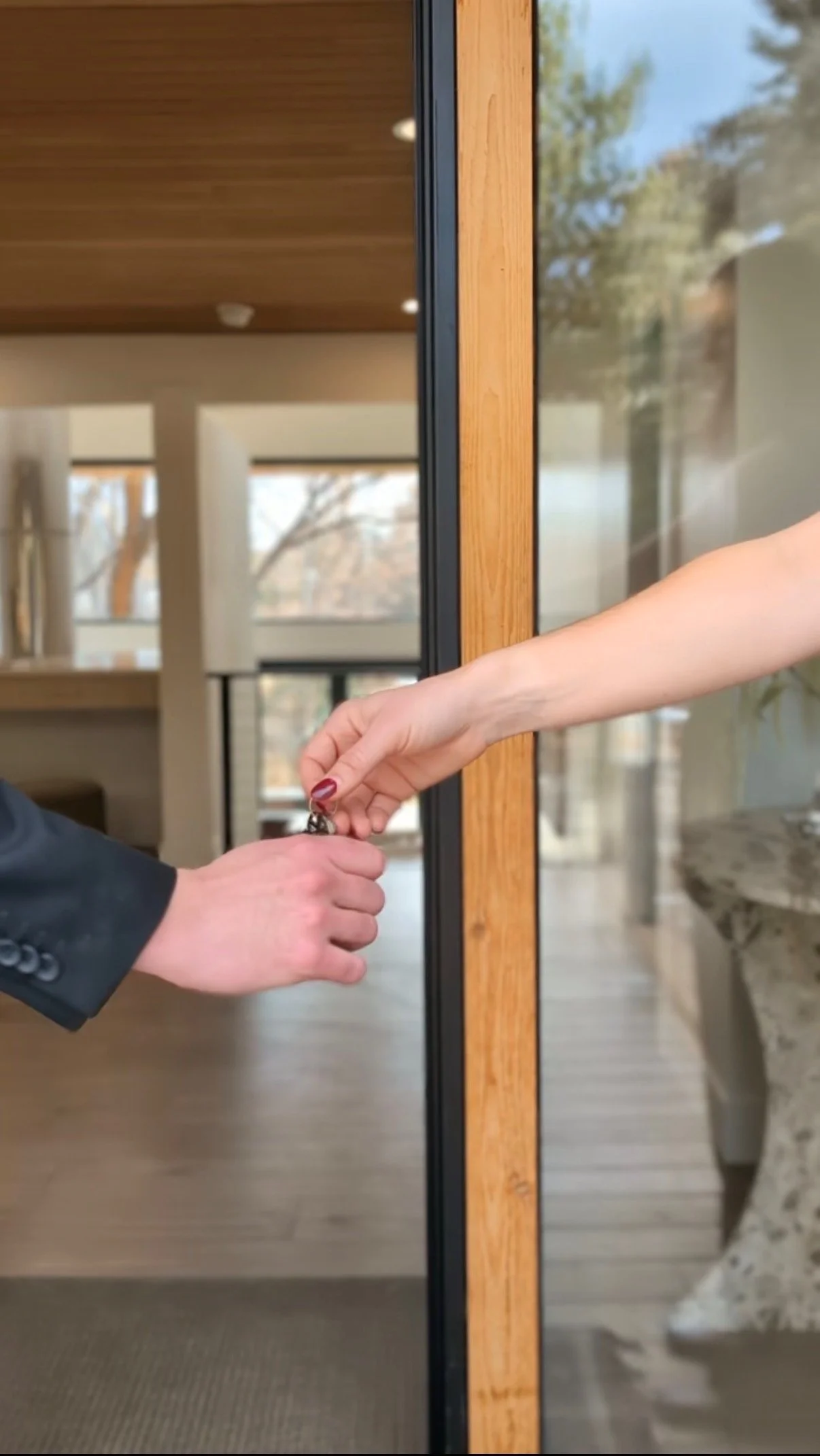 Home buyer receiving keys at closing in Denver