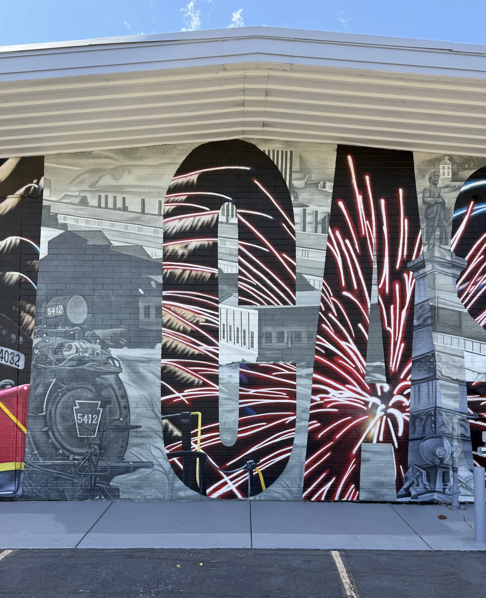 This large-scale mural was designed to captured the identity of New Castle by contrasting its industrial heritage with the city's modern character. Hand-painted across a 50' x 18' wall using acrylic, oil, and spray paint.