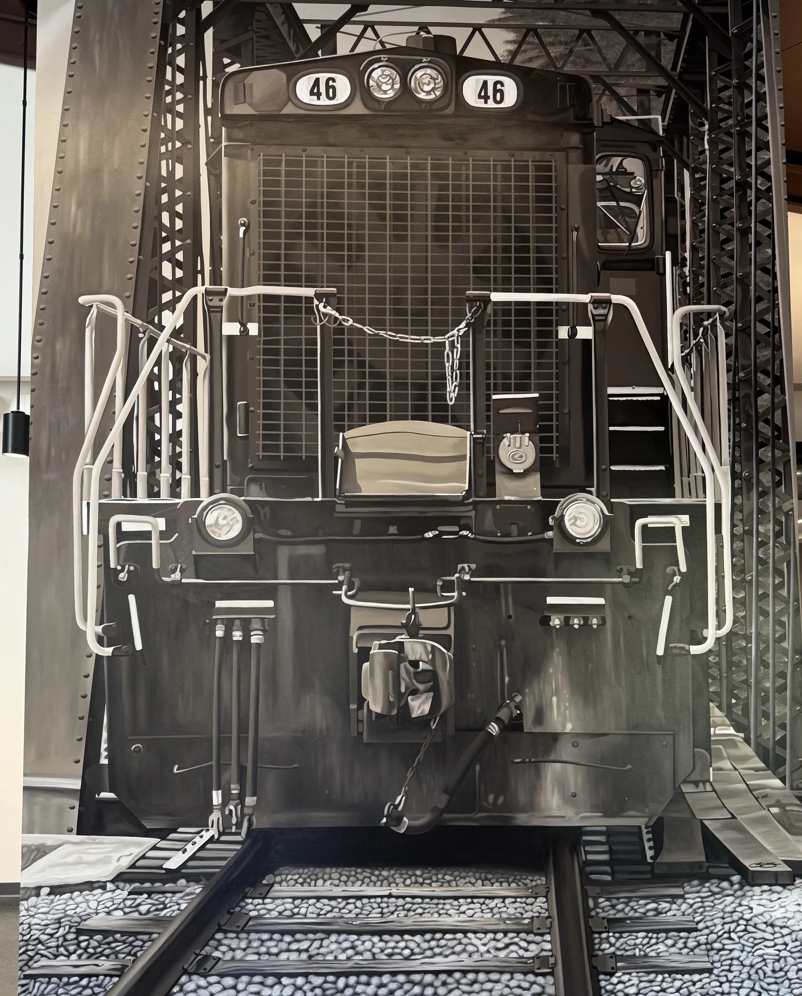 This 19' x 9' hyperrealistic mural was hand-painted in acrylic for New Castle Industrial Railroad, accompanied by the historic logos of its connecting railroads to honor the region's rich railroad heritage.