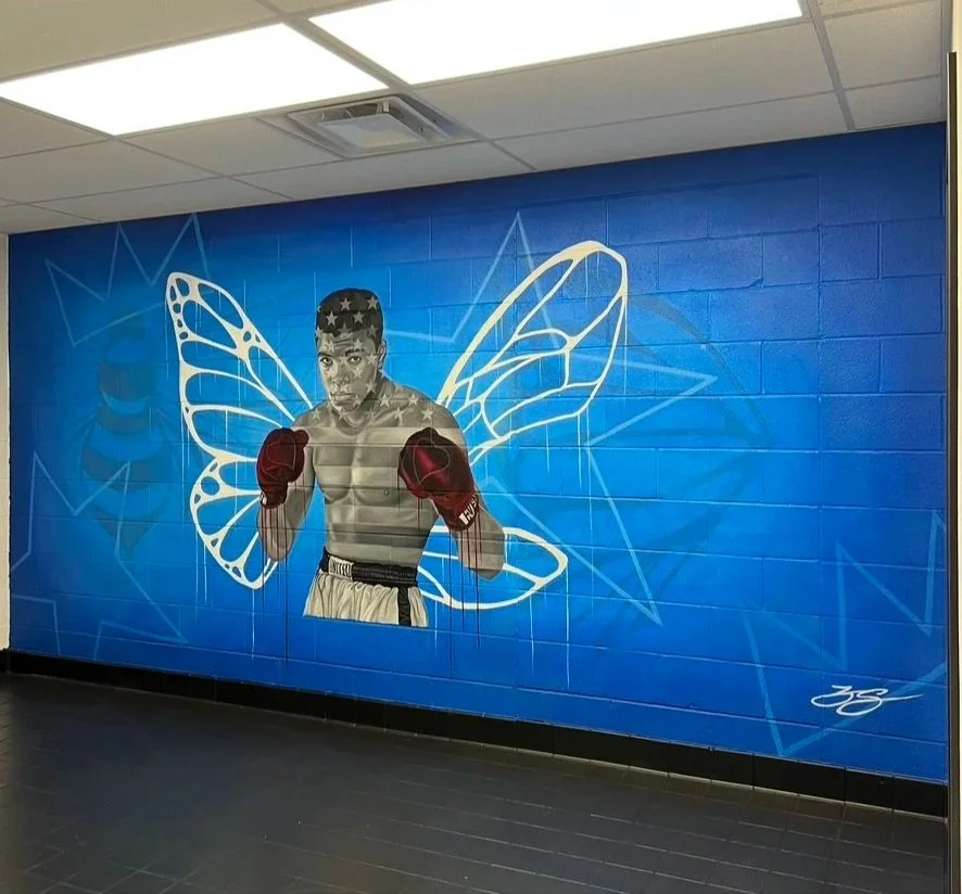 Interior mural commissioned by the LeBron James Family Foundation for House Three Thirty. The portrait of Muhammad Ali was created using acrylic and oil paint, honoring legacy, resilience and cultural impact.