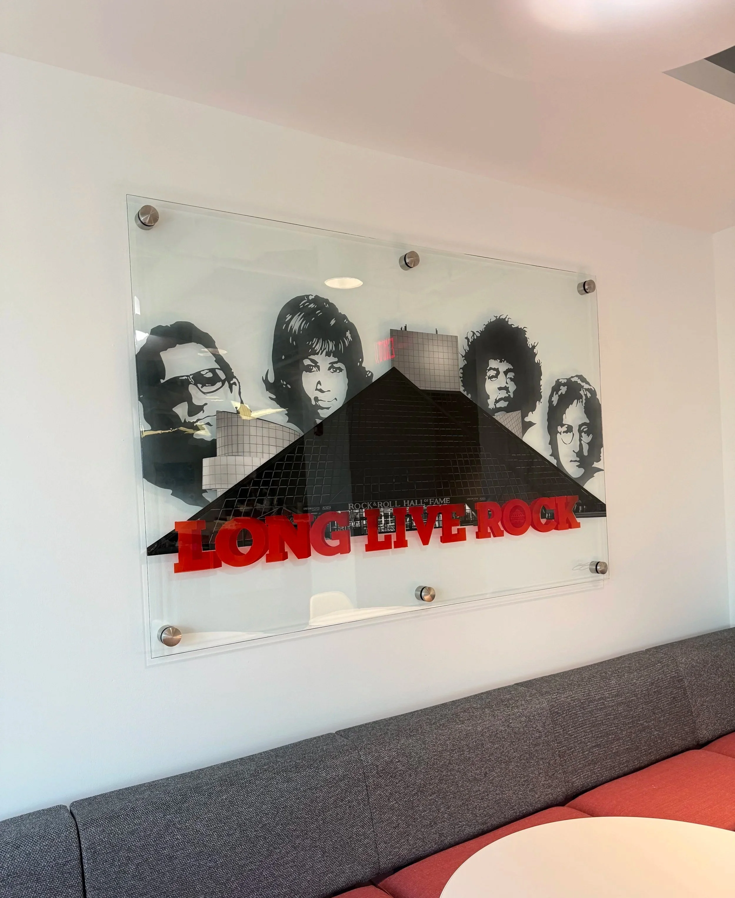 Rock & Roll Hall of Fame inspired glass installation created with oil paint, layered stained glass techniques and epoxy resin on 4ft x 6ft tempered glass. Installed using floating stainless steel standoffs. Over 200 hours in creation.