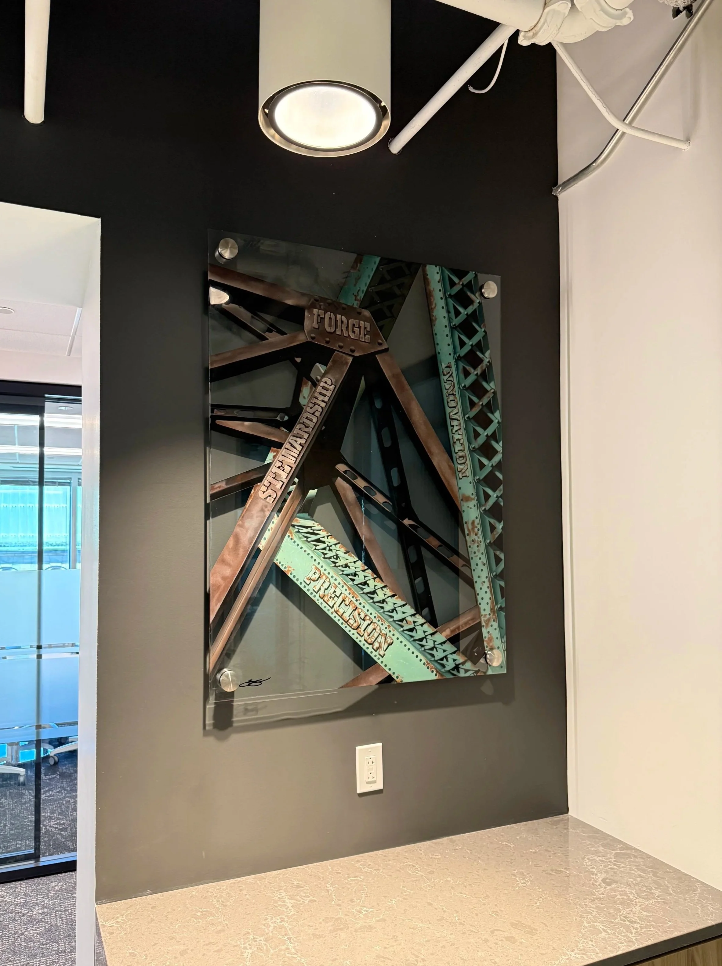 Cleveland steel industry inspired glass installation featuring industrial bridge structures painted on 3ft x 4ft tempered glass. Finished with epoxy resin and floating stainless steel standoff mounting. Approximately 150 hours in creation.