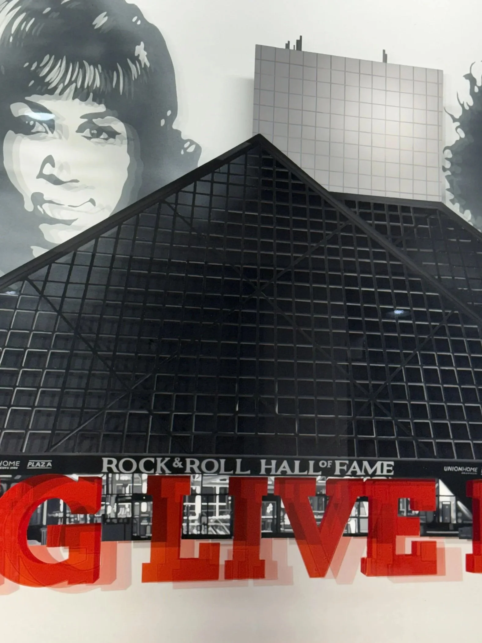 Rock & Roll Hall of Fame inspired installation featuring hand-painted building elements & layered stained glass on 4ft x 6ft tempered glass. Finished with epoxy resin & mounted using standoff mounting. Over 200 hours in creation.