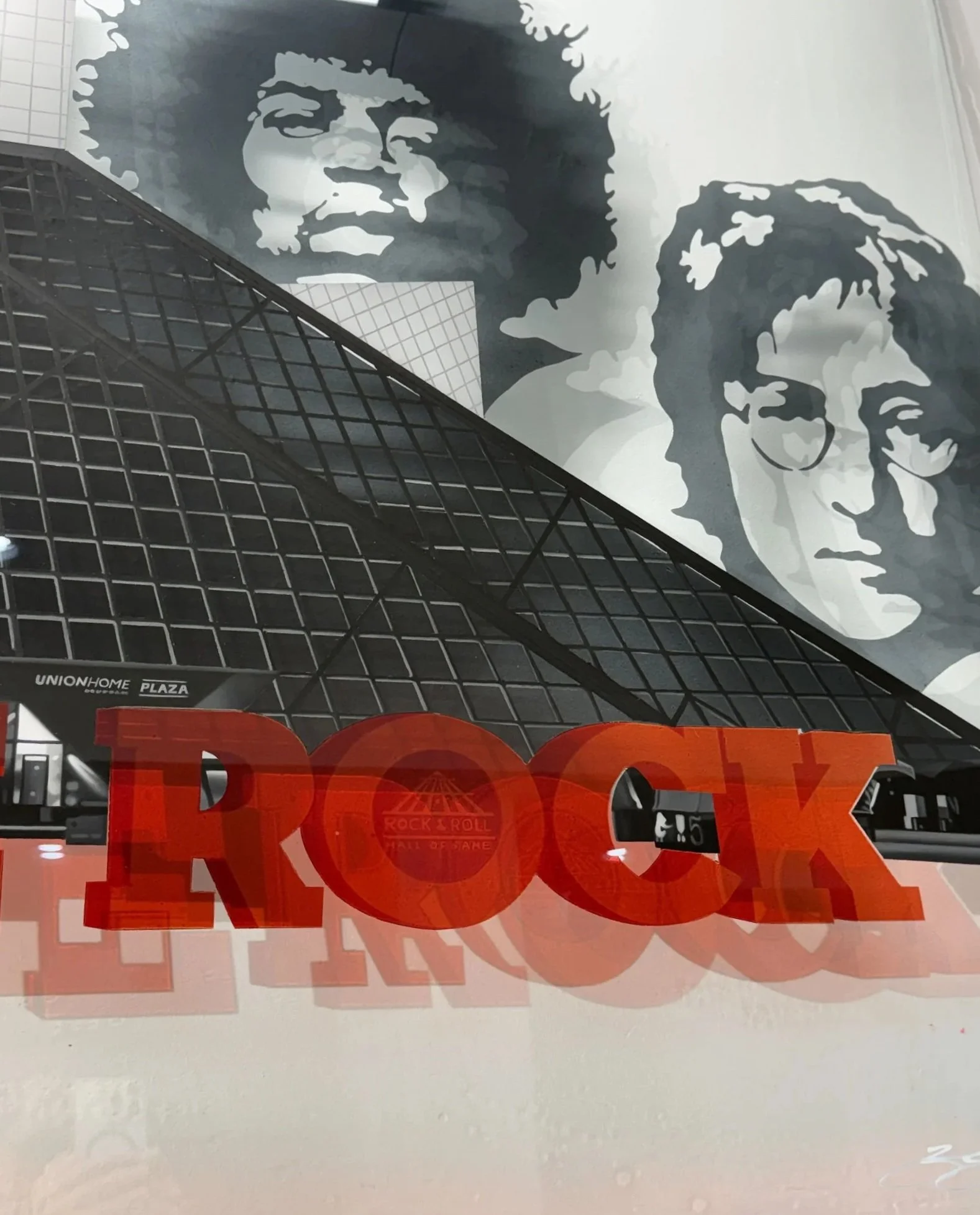Rock & Roll Hall of Fame inspired installation featuring hand-painted building elements & layered stained glass on 4ft x 6ft tempered glass. Finished with epoxy resin & mounted using standoff mounting. Over 200 hours in creation.