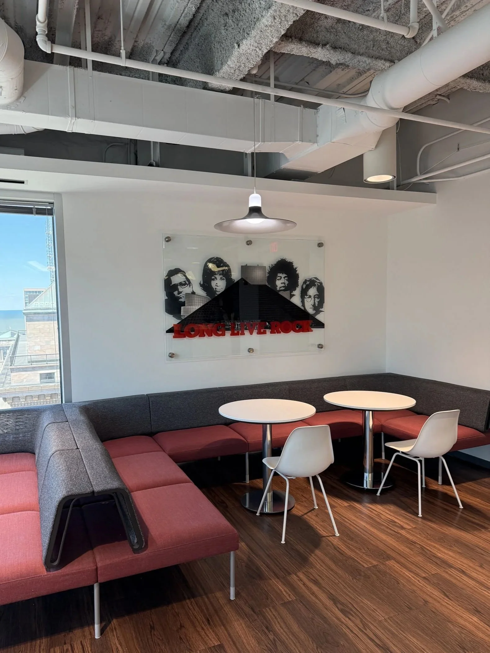 Rock & Roll Hall of Fame inspired installation featuring hand-painted building elements & layered stained glass on 4ft x 6ft tempered glass. Finished with epoxy resin & mounted using standoff mounting. Over 200 hours in creation.