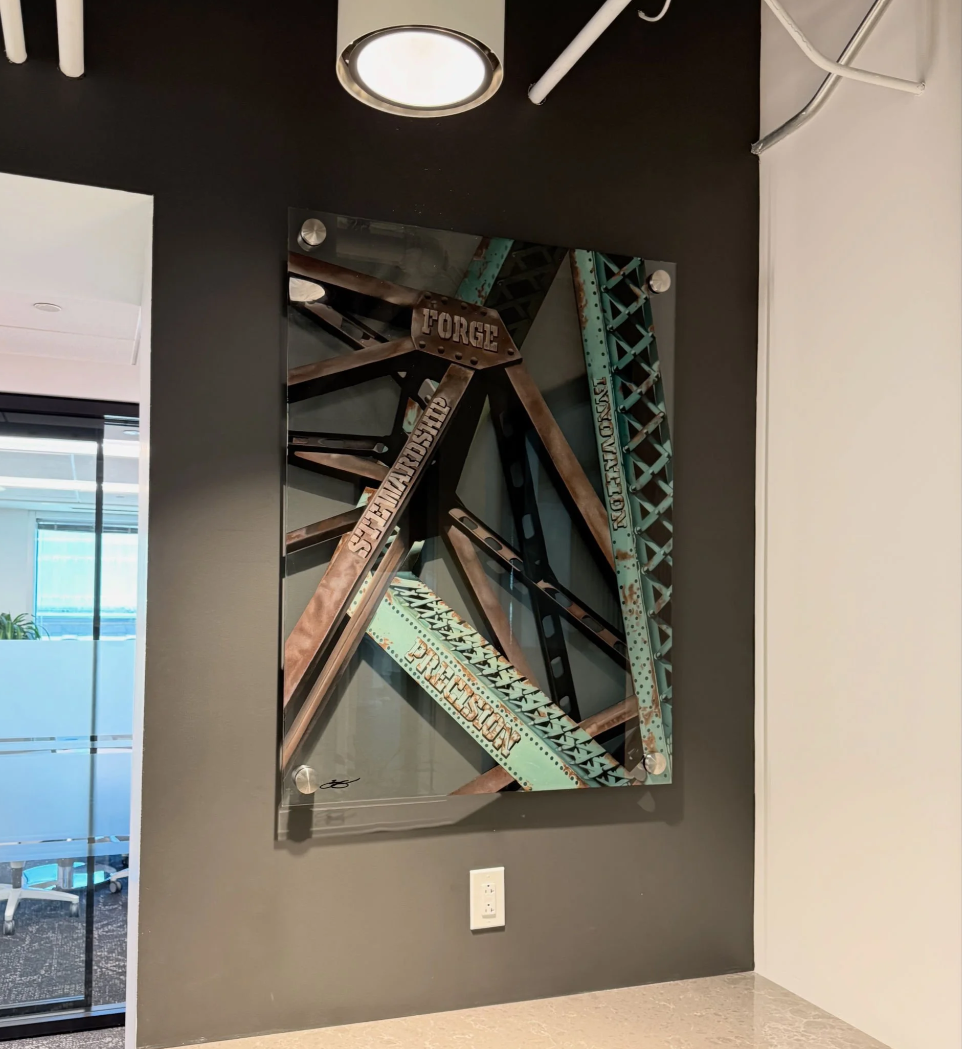 Cleveland steel industry inspired glass installation featuring industrial bridge structures painted on 3ft x 4ft tempered glass. Finished with epoxy resin and floating stainless steel standoff mounting. Approximately 150 hours in creation.