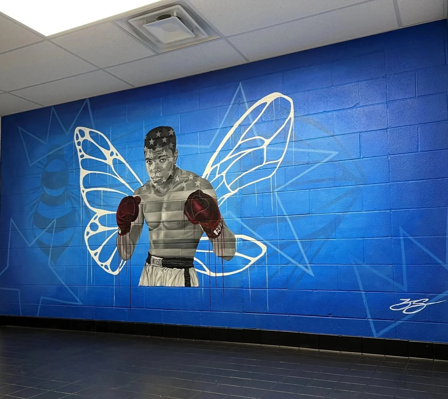 Interior mural commissioned by the LeBron James Family Foundation for House Three Thirty. The portrait of Muhammad Ali was created using acrylic and oil paint, honoring legacy, resilience and cultural impact.