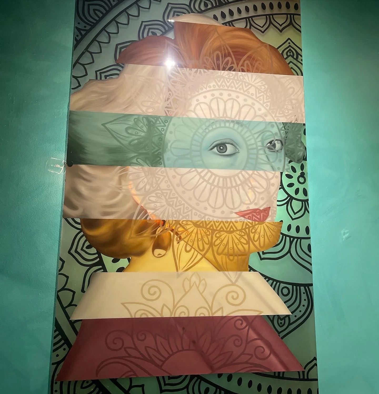 Designed in response to the restaurant's Mediterranean identity, the three-panel plexiglass installation incorporates oil, acrylic, stained glass paint and resin with LED backlighting to create a cohesive, immersive focal point.