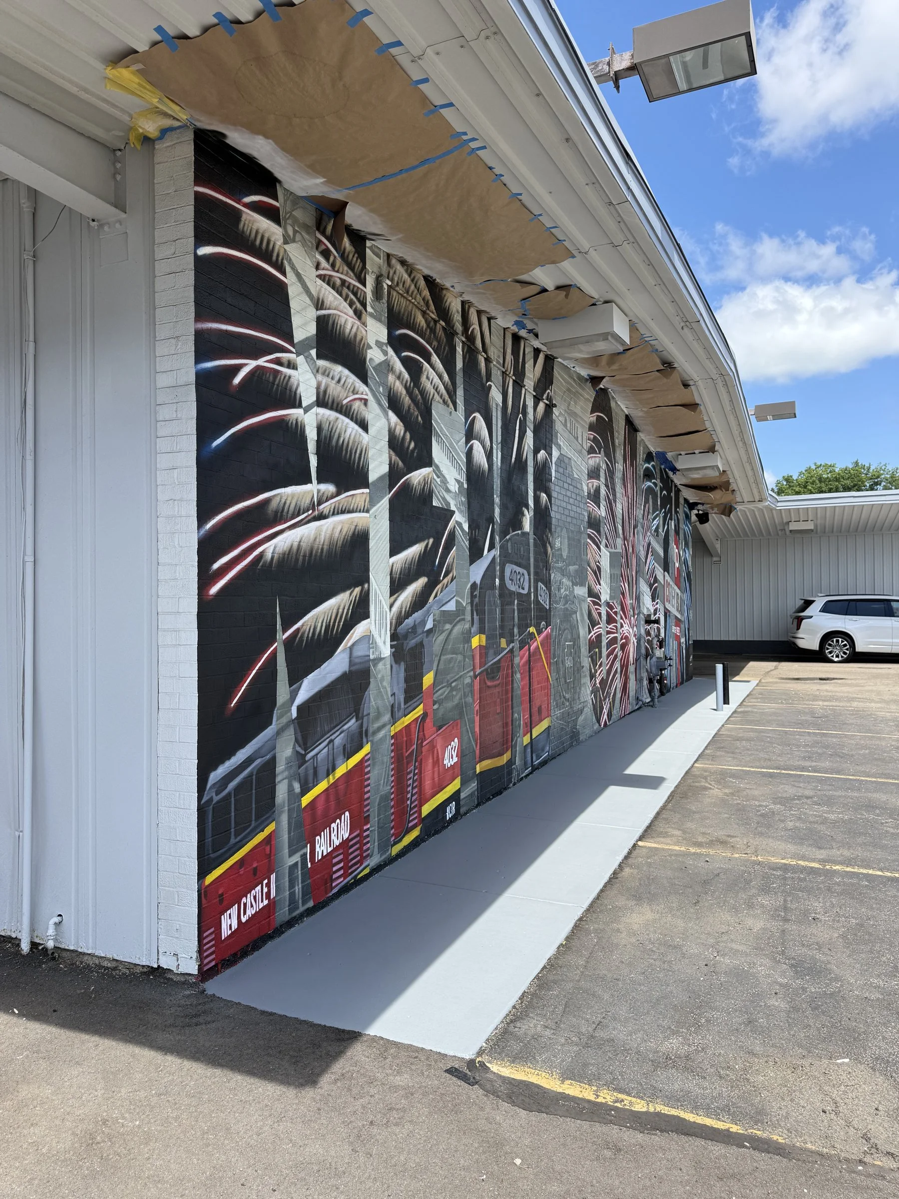 This large-scale mural was designed to captured the identity of New Castle by contrasting its industrial heritage with the city's modern character. Hand-painted across a 50' x 18' wall using acrylic, oil, and spray paint.