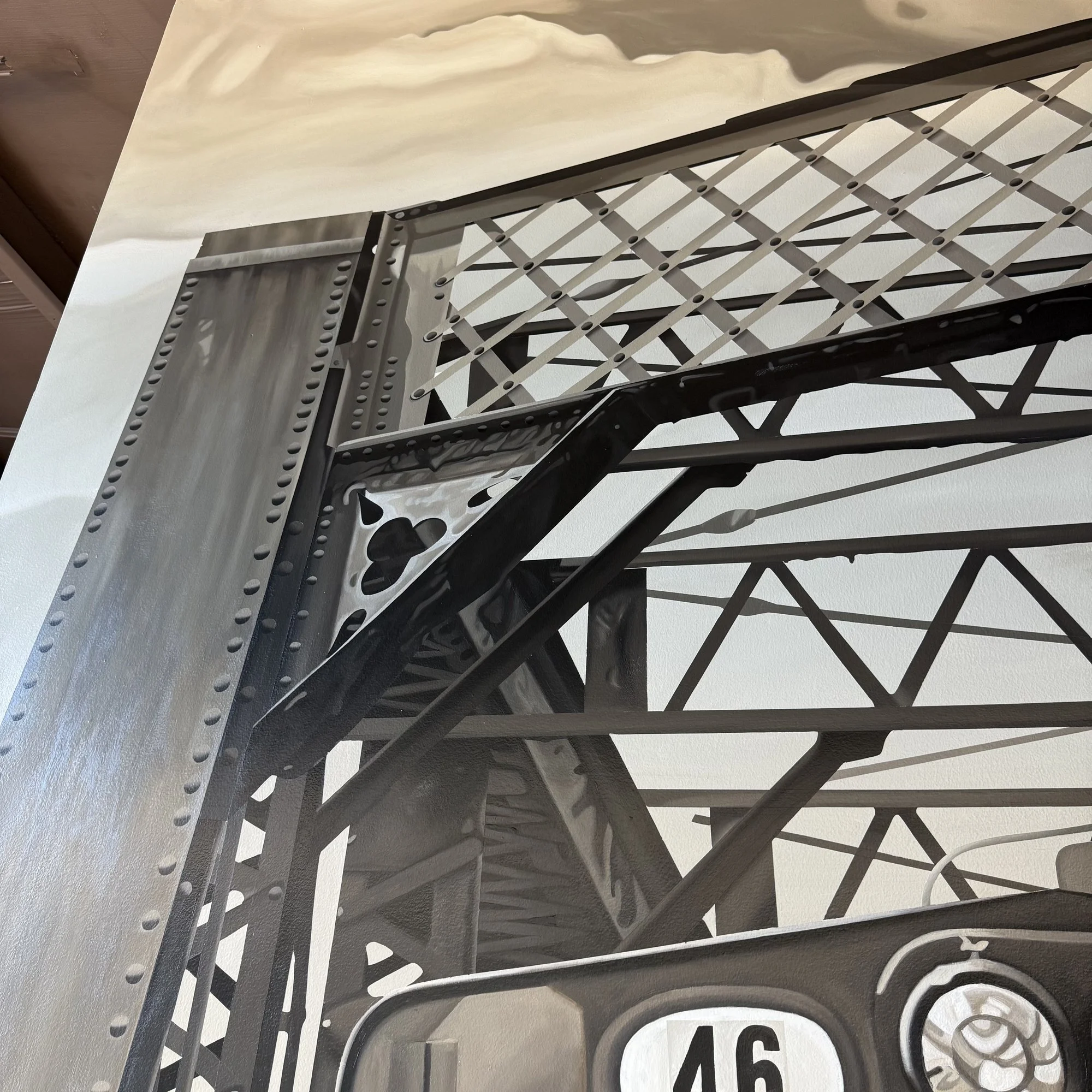 This 19' x 9' hyperrealistic mural was hand-painted in acrylic for New Castle Industrial Railroad, accompanied by the historic logos of its connecting railroads to honor the region's rich railroad heritage.