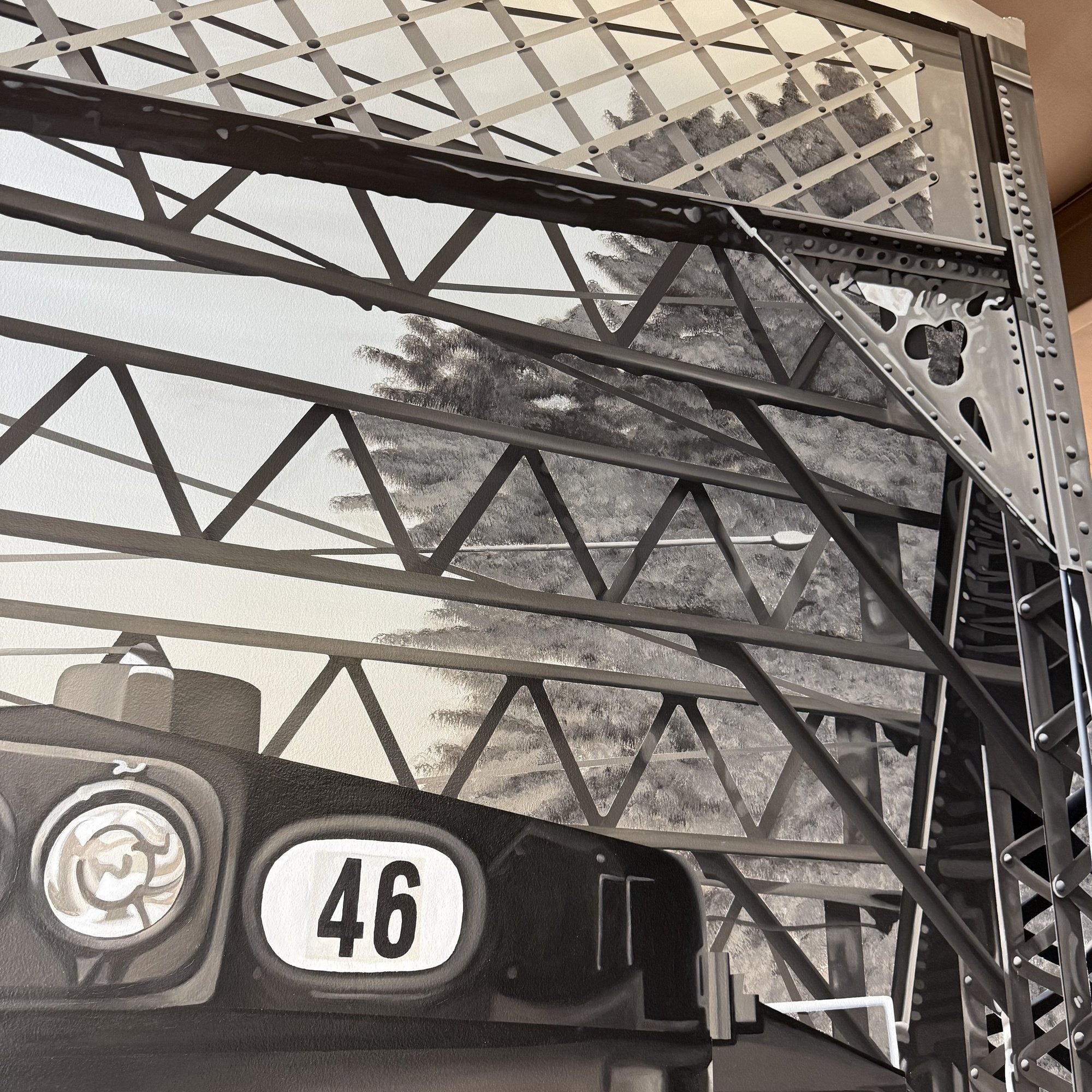 This 19' x 9' hyperrealistic mural was hand-painted in acrylic for New Castle Industrial Railroad, accompanied by the historic logos of its connecting railroads to honor the region's rich railroad heritage.