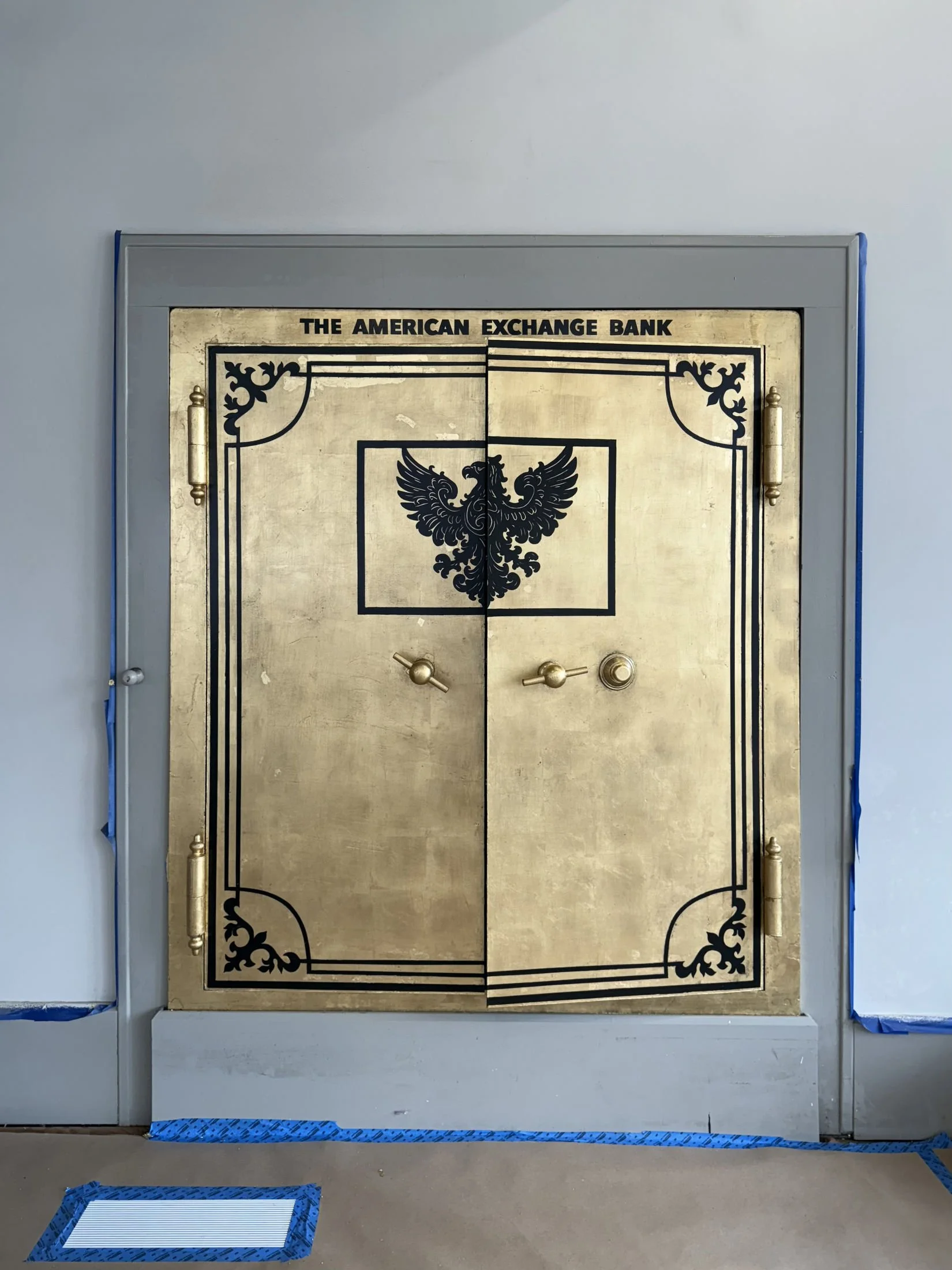 Restoration and redesign of historic bank vaults built in 1818 within the oldest commercial building in Canton, Ohio. Featuring hand-applied gold leaf, custom detailing, and architectural enamel finishes throughout the installation.