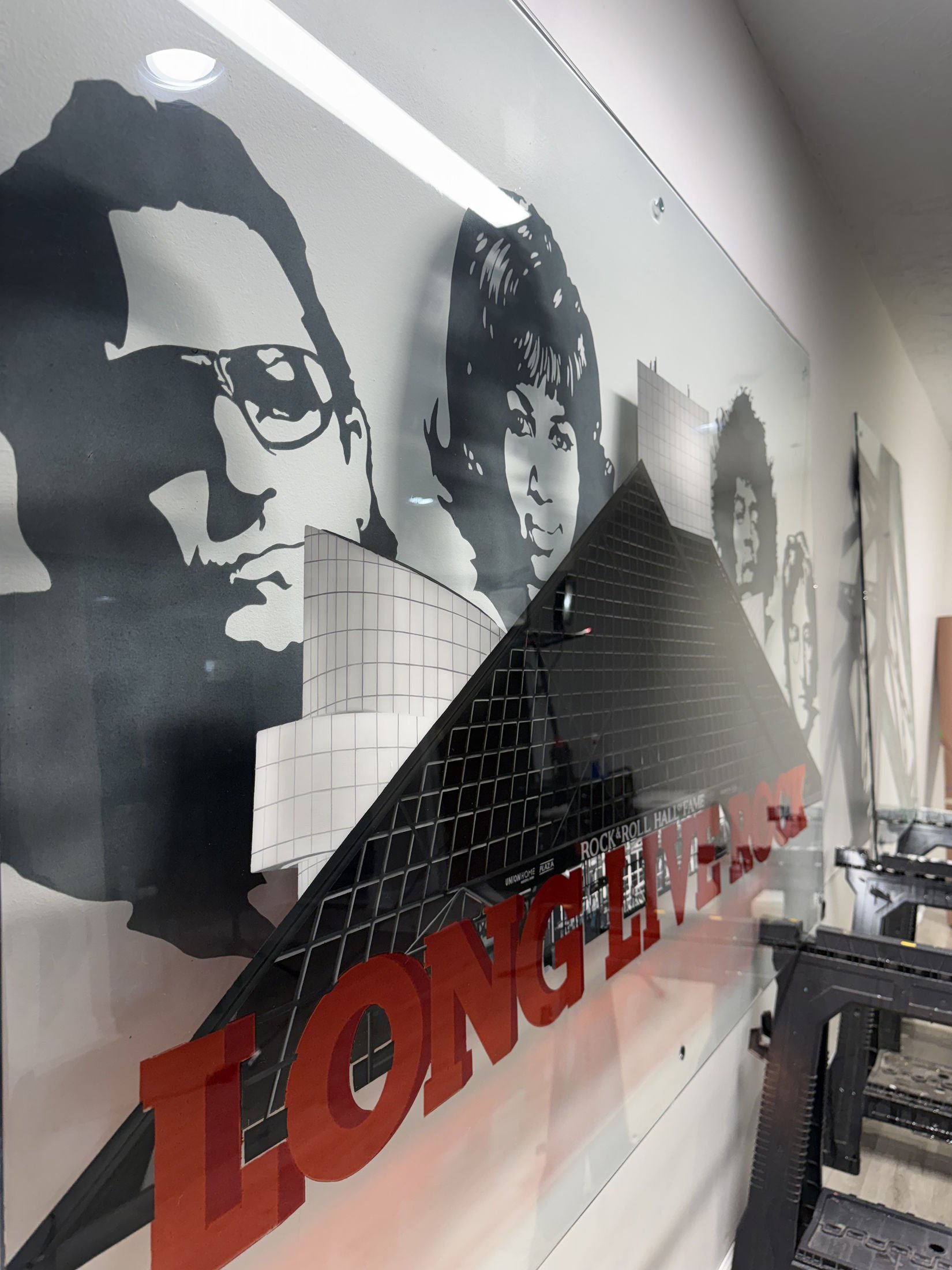 Rock & Roll Hall of Fame inspired installation featuring hand-painted building elements & layered stained glass on 4ft x 6ft tempered glass. Finished with epoxy resin & mounted using standoff mounting. Over 200 hours in creation.