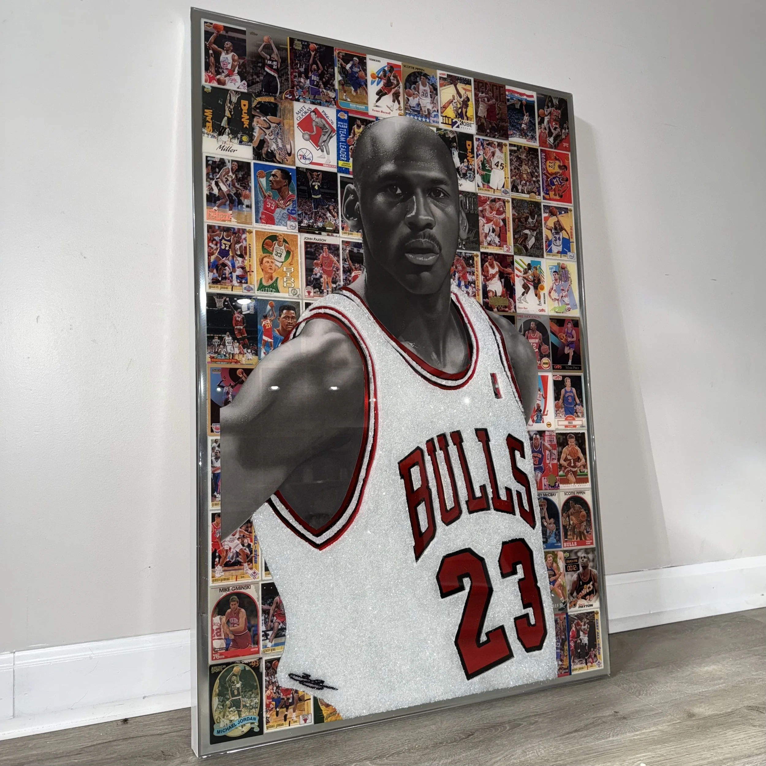 Graphite portrait layered over original NBA trading cards from Michael Jordan's active years. Stained glass paint, ink, resin and diamond dust on mirror. Mounted to canvas. 24 x 36 in.