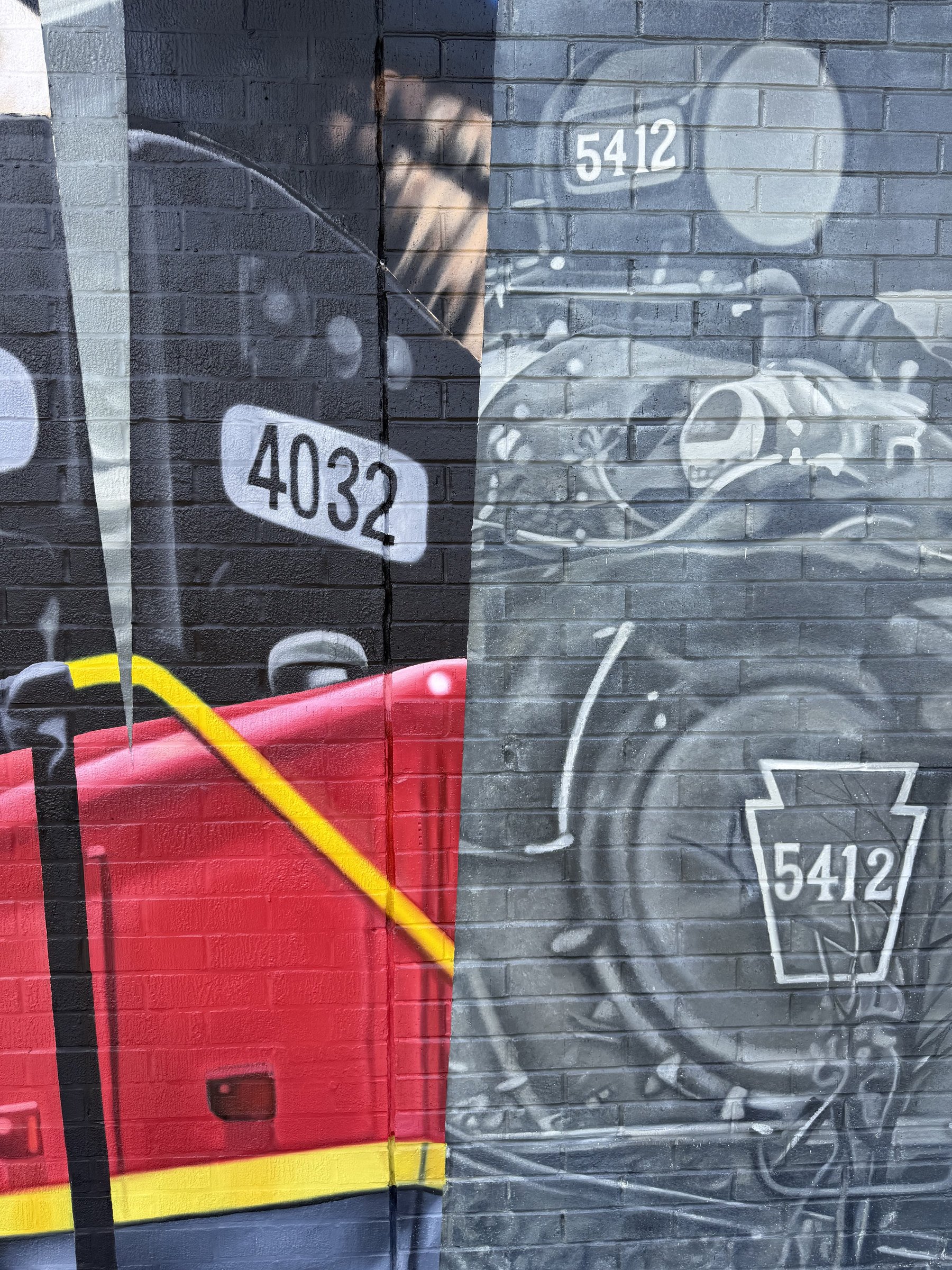 This large-scale mural was designed to captured the identity of New Castle by contrasting its industrial heritage with the city's modern character. Hand-painted across a 50' x 18' wall using acrylic, oil, and spray paint.