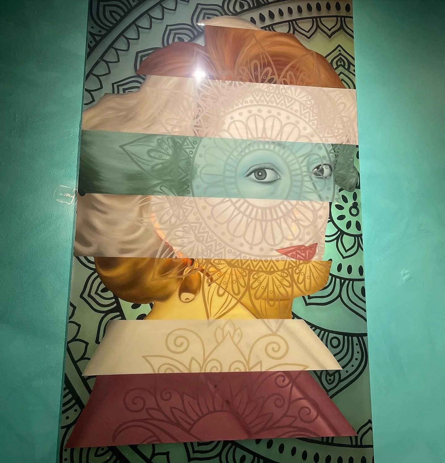 Designed in response to the restaurant's Mediterranean identity, the three-panel plexiglass installation incorporates oil, acrylic, stained glass paint and resin with LED backlighting to create a cohesive, immersive focal point.
