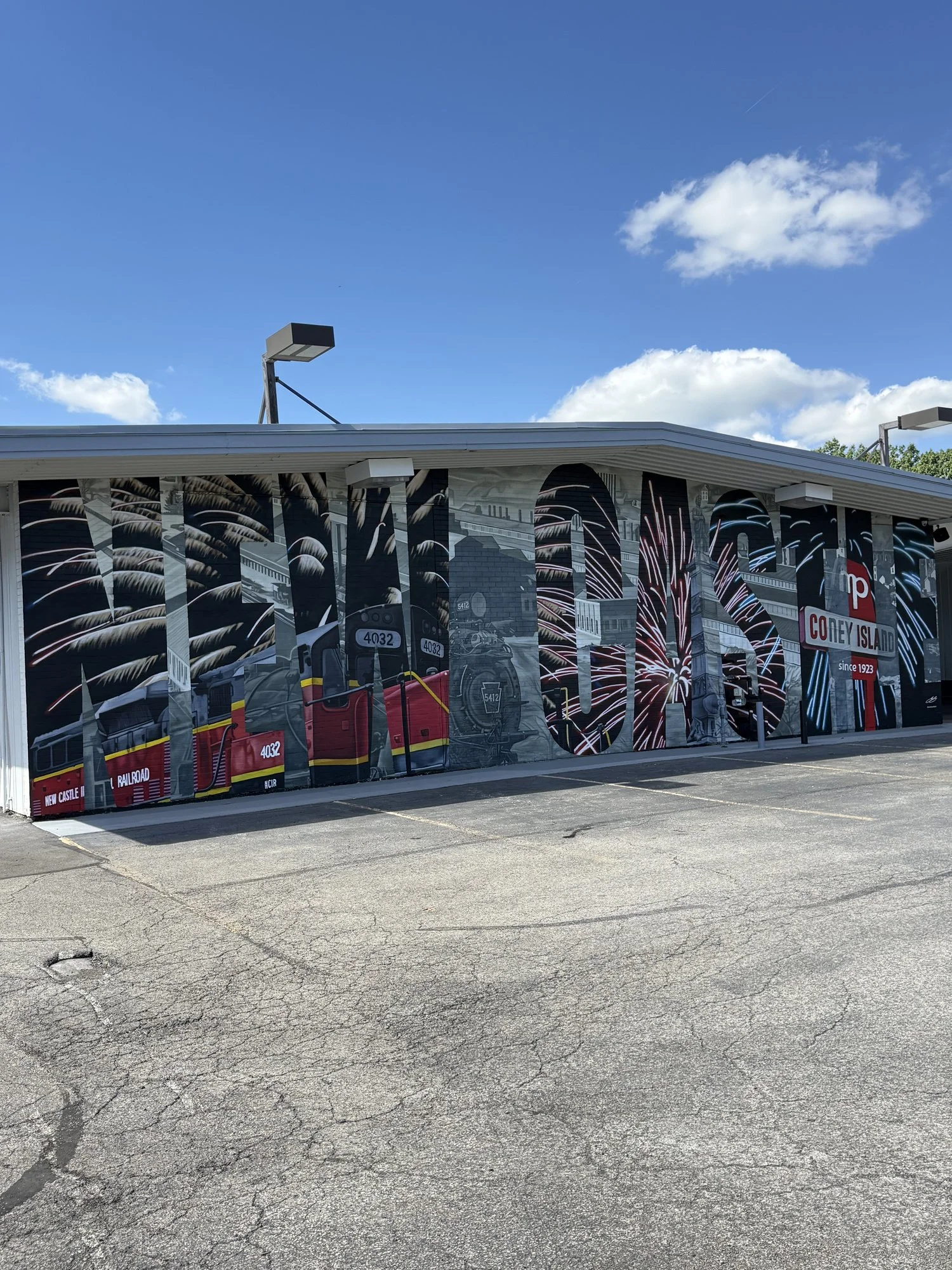 This large-scale mural was designed to captured the identity of New Castle by contrasting its industrial heritage with the city's modern character. Hand-painted across a 50' x 18' wall using acrylic, oil, and spray paint.