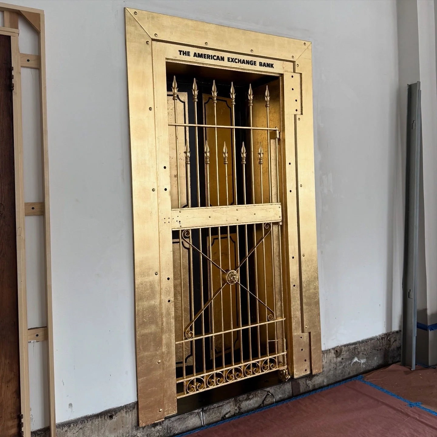Restoration and redesign of historic bank vaults built in 1818 within the oldest commercial building in Canton, Ohio. Featuring hand-applied gold leaf, custom detailing, and architectural enamel finishes throughout the installation.