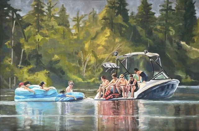 Group of people enjoying a boat ride on a lake with lush green trees in the background.