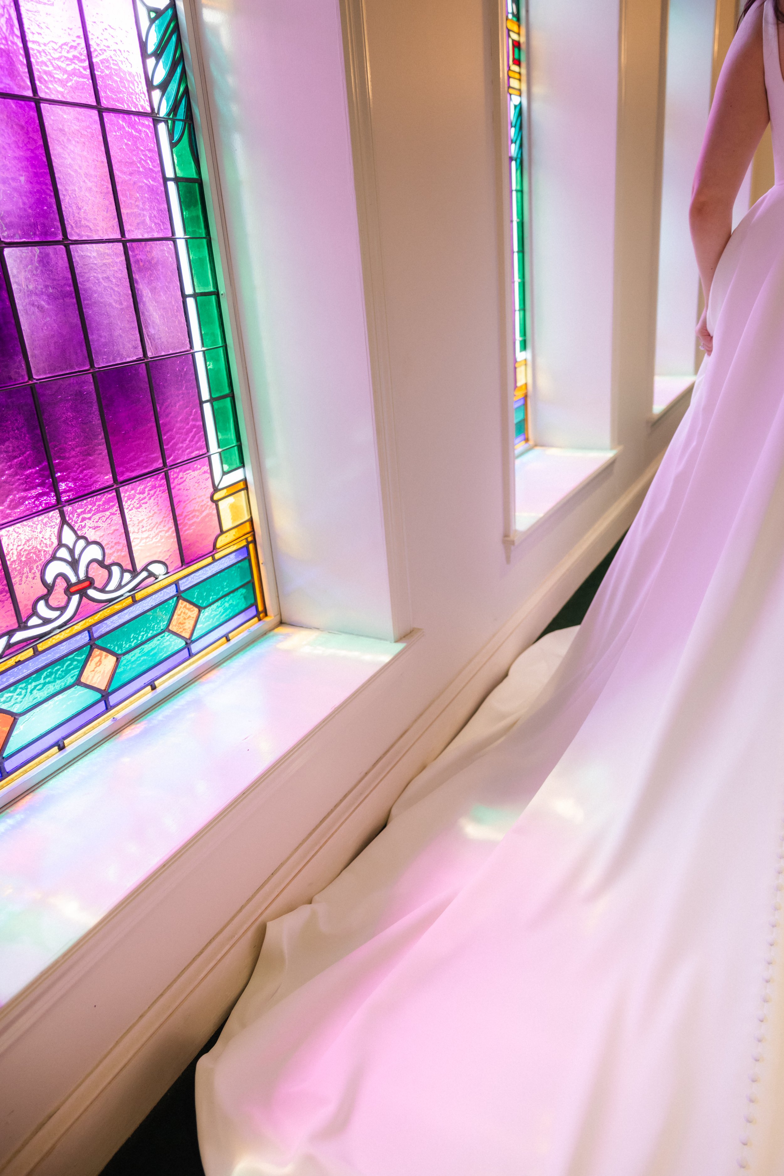 Wedding dress reflected with stained glass