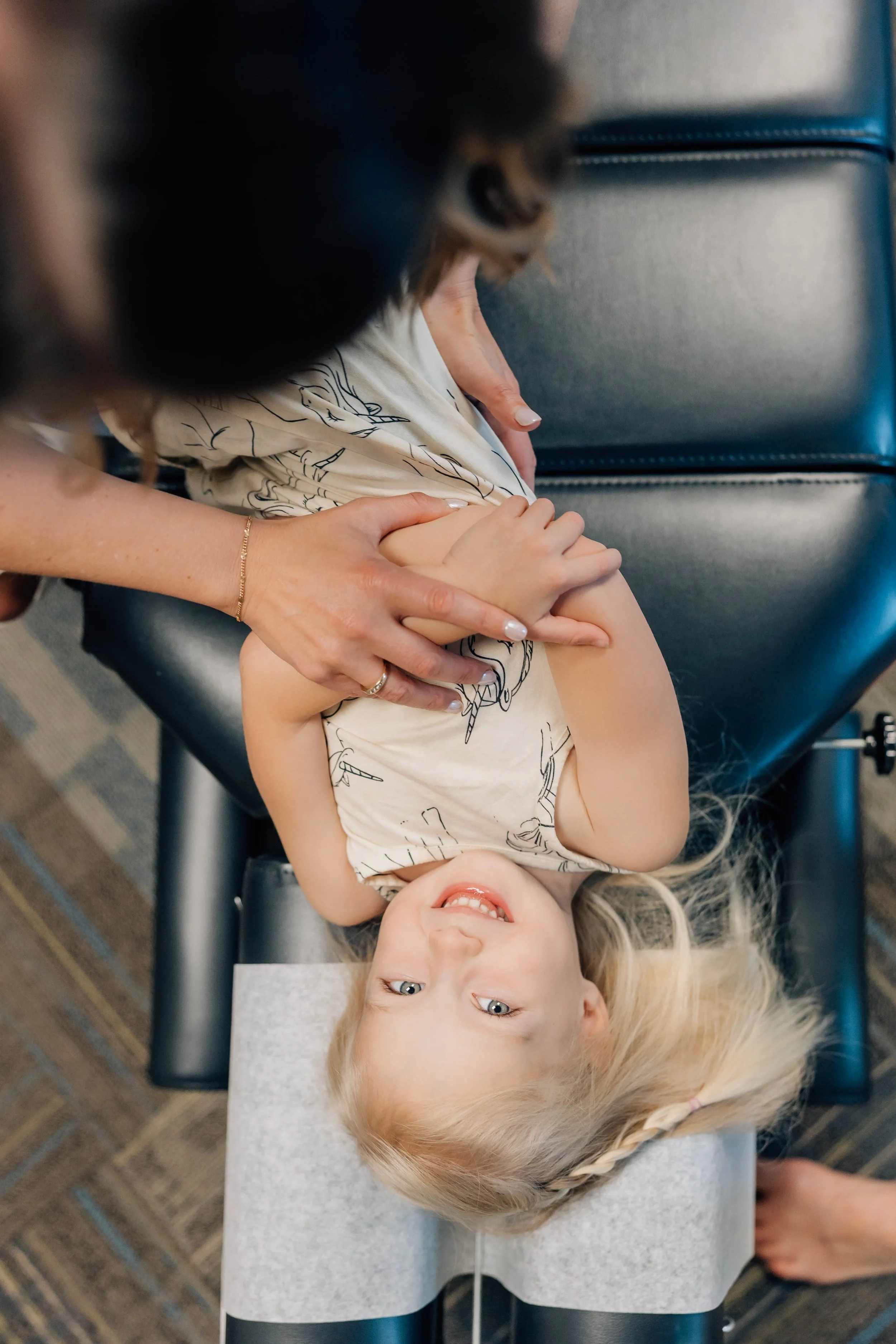 Child-friendly chiropractic adjustment in Vancouver, WA, helping infants and children with colic, reflux, sleep issues, and digestive health.