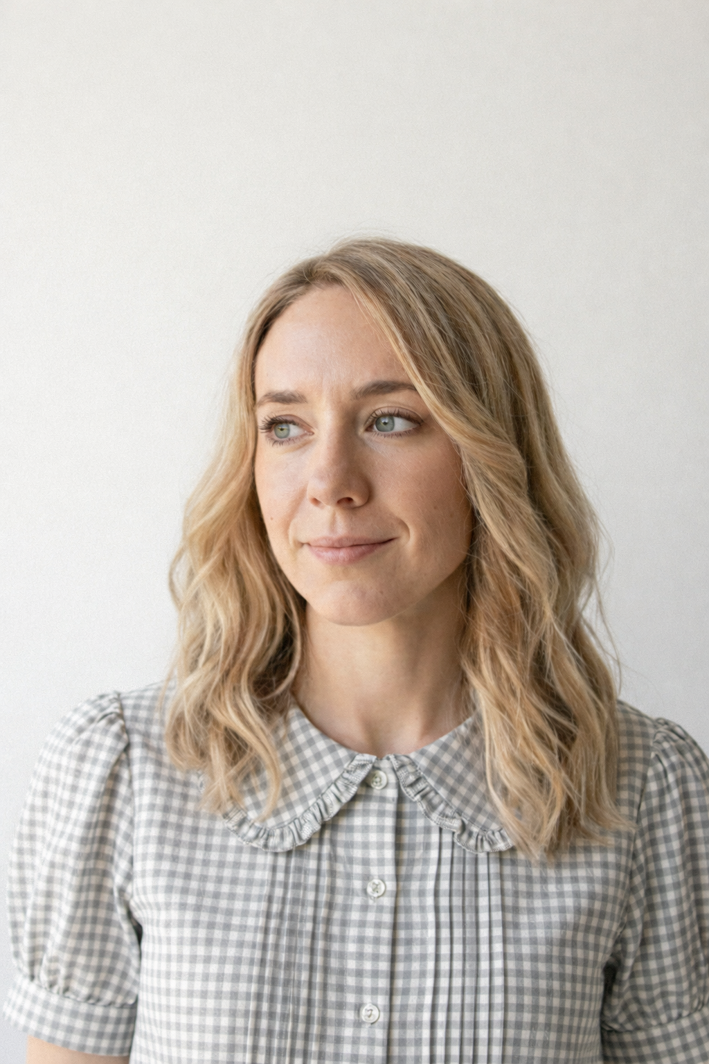 Headshot of Cassie Broeckert, content designer and AI strategist