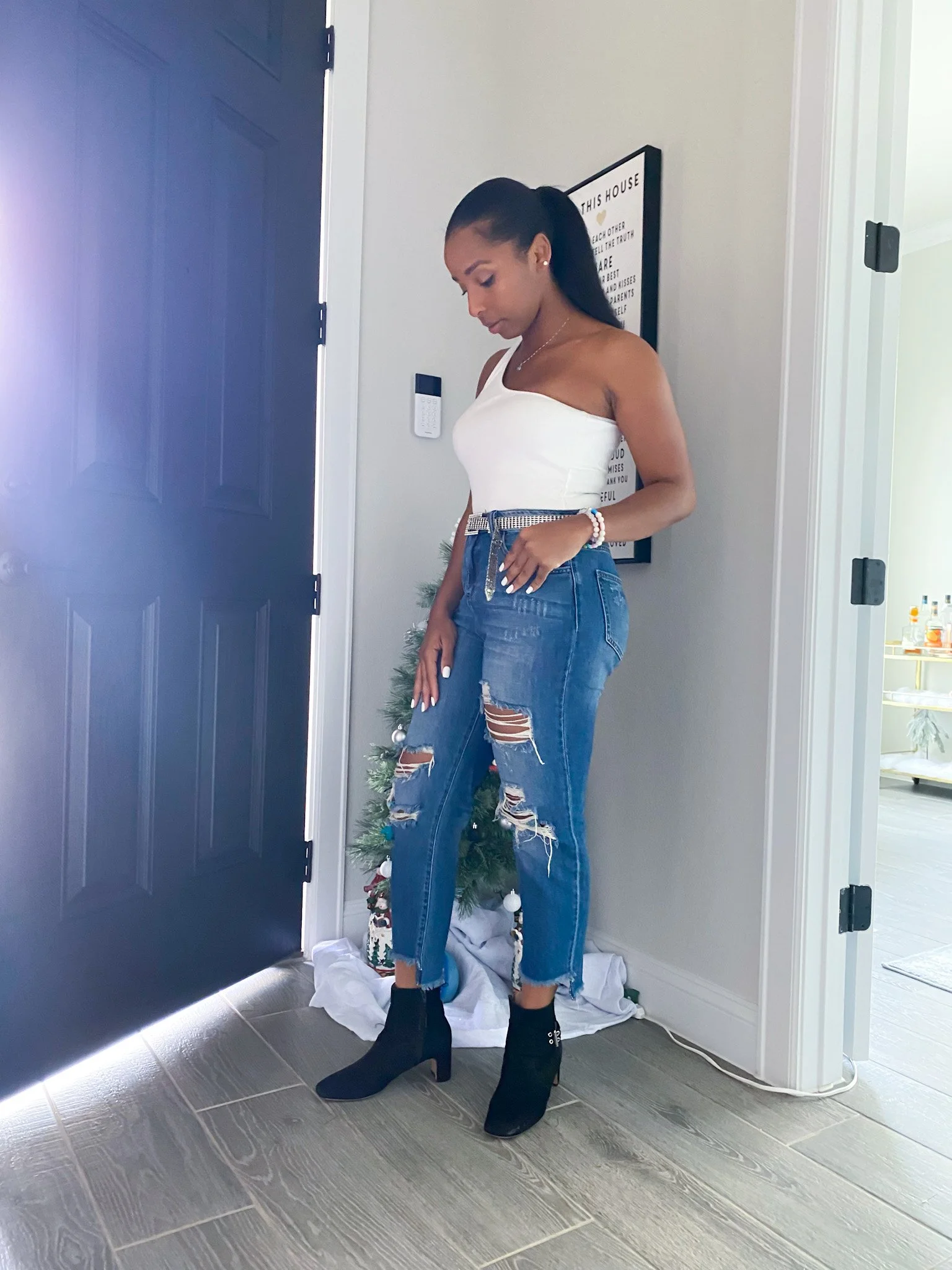 LaNese in One Shoulder Top and Distressed Jean with Black Booties