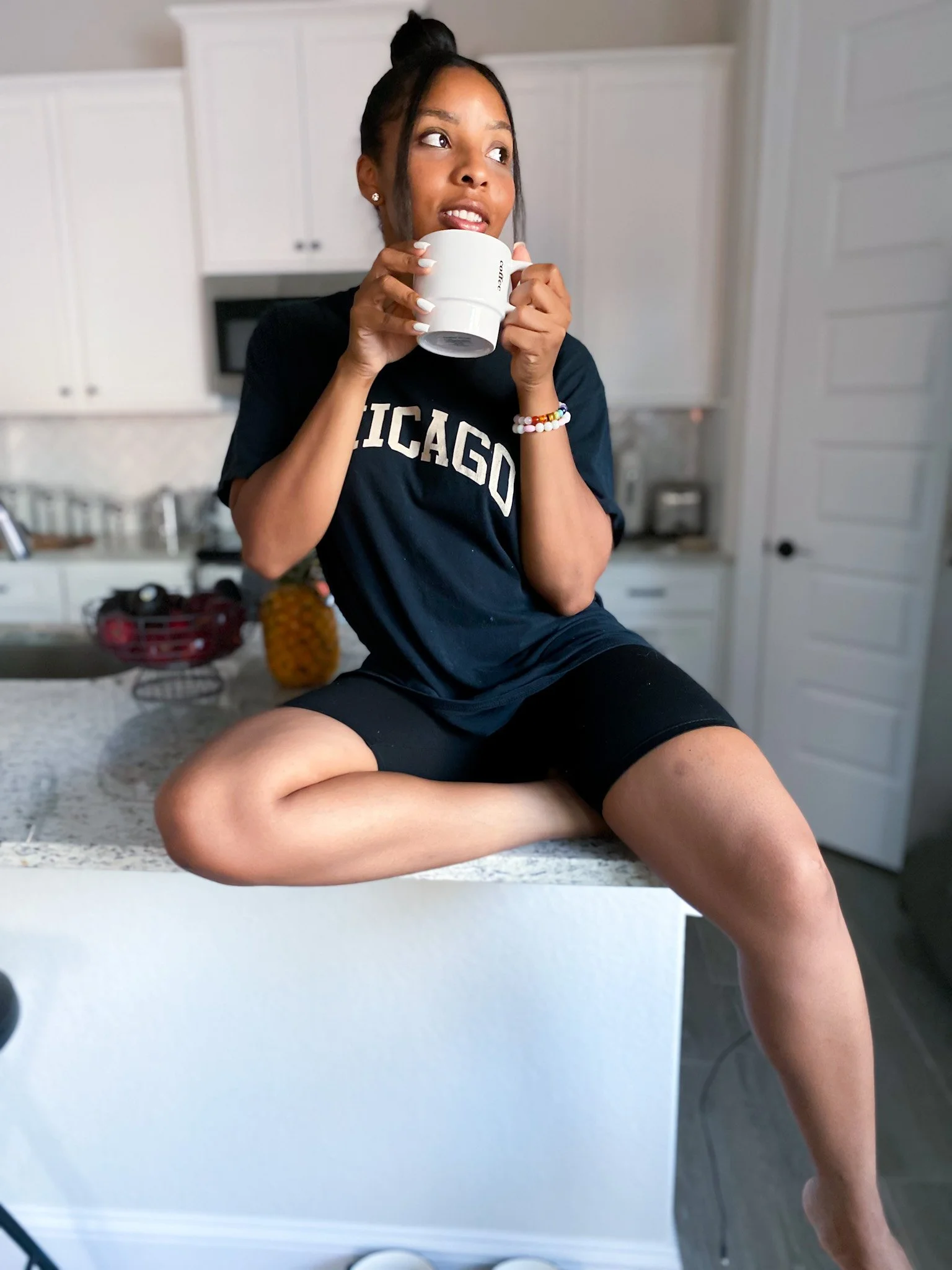 LaNese Wearing Chicago Shirt in her kitchen