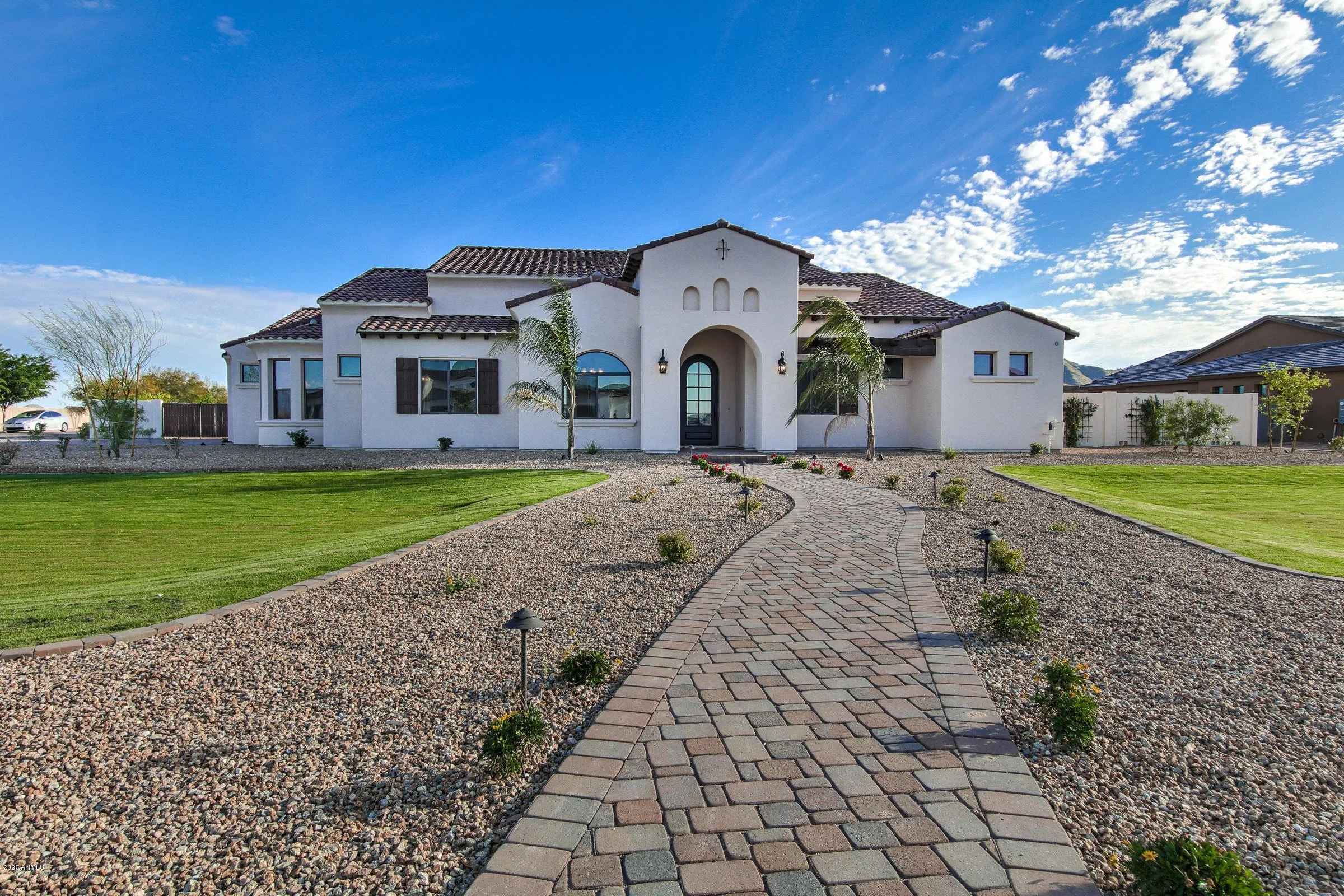 Residential stucco installation on a single-family home in the Phoenix metro area by Venetian Plastering.
