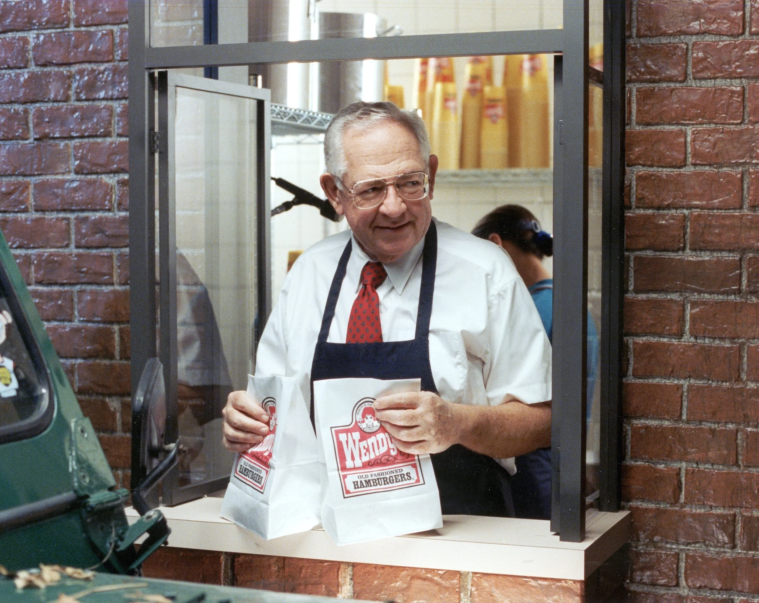 Dave Thomas in a Wendy's Pick-Up Window for a commercial