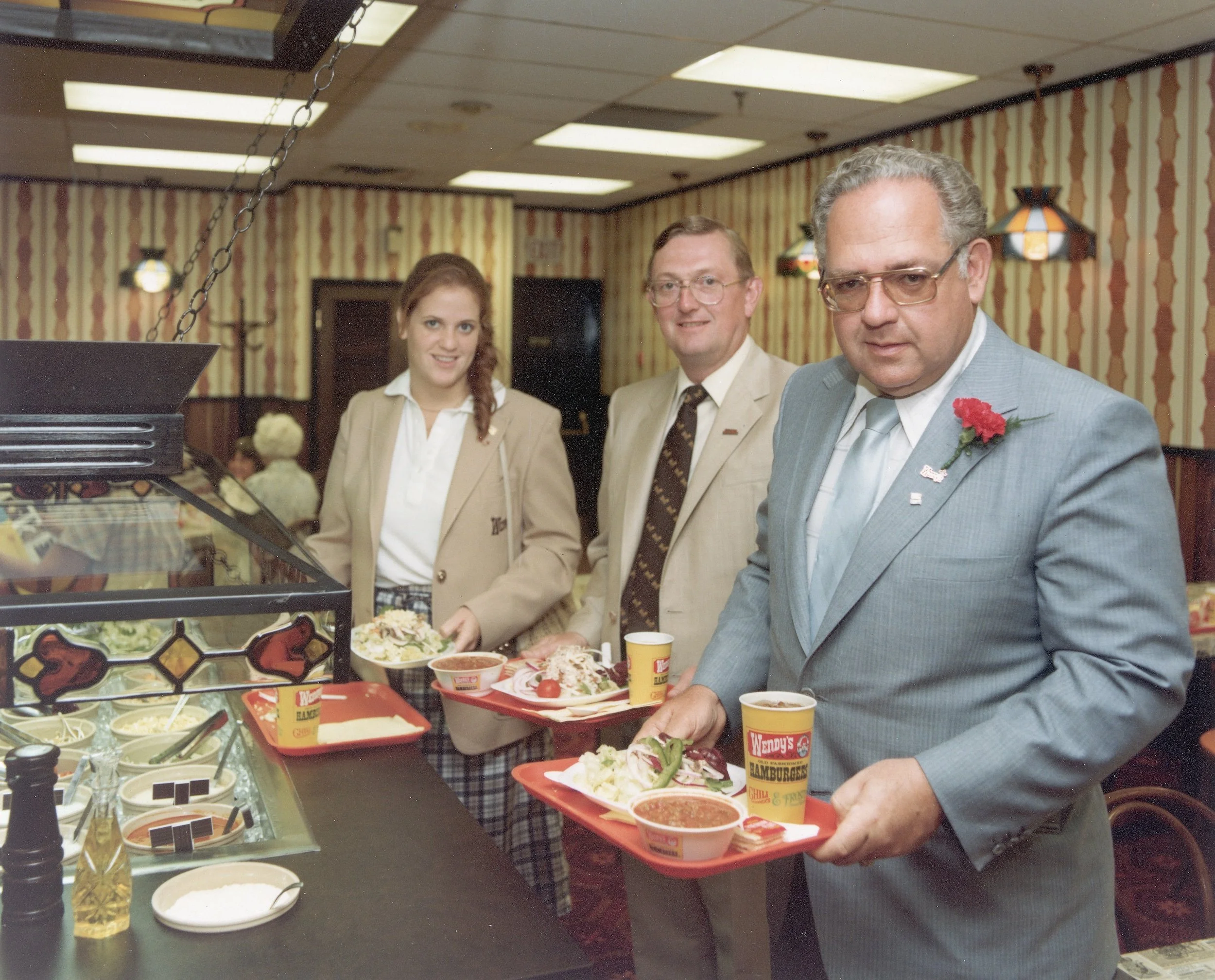 Dave Thomas at a Wendy's restaurant along with his daughter, Wendy