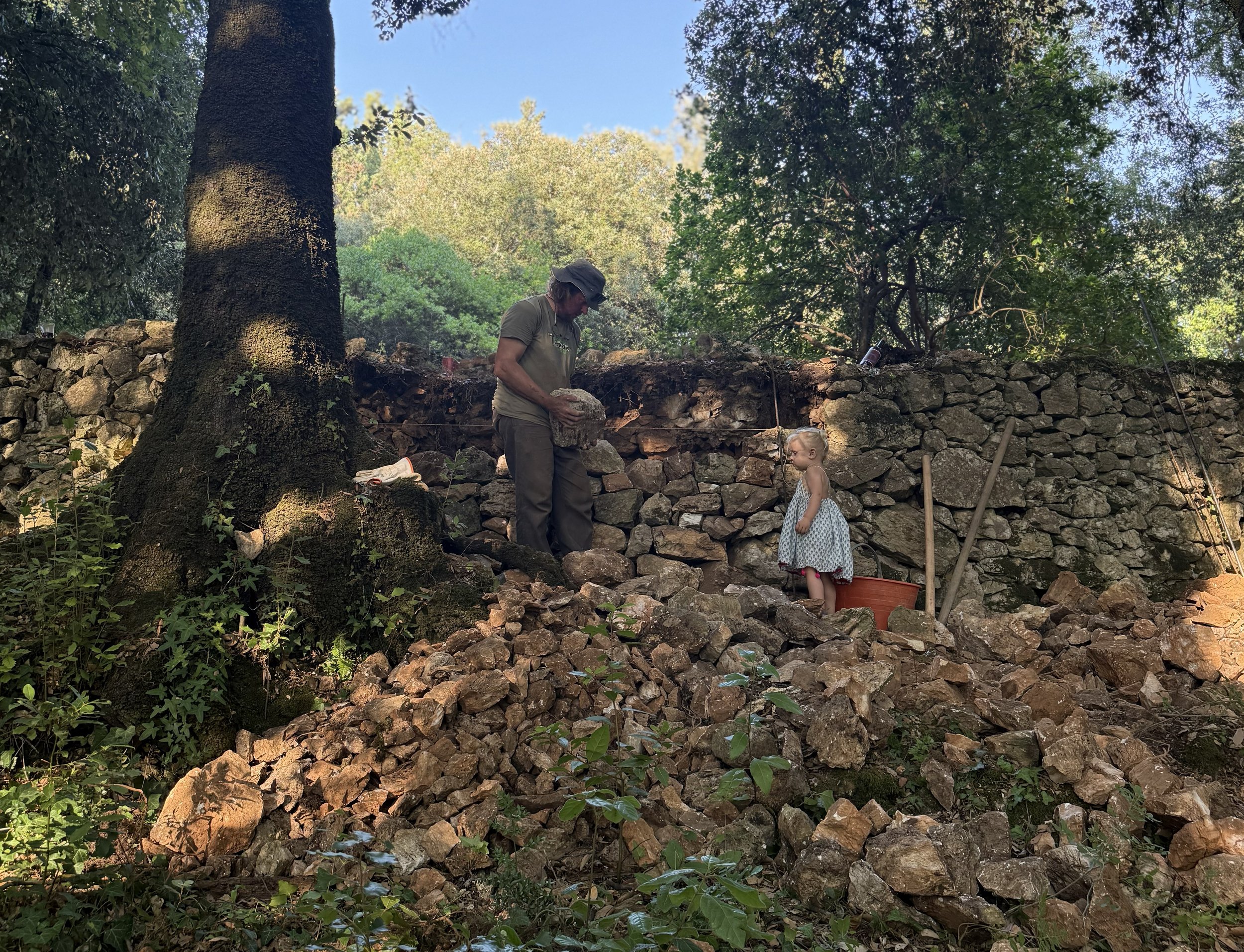 Adam with daughter and stonewall.jpg