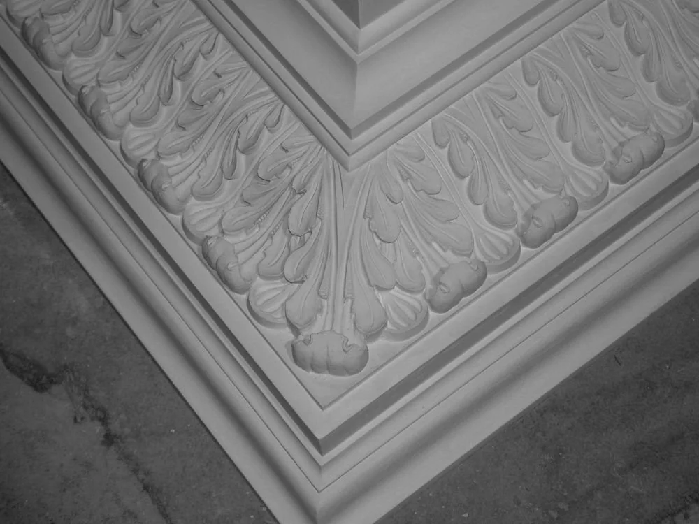 Model of historic plaster corner molding for reproduction, featuring acanthus leaves and traditional decorative elements.