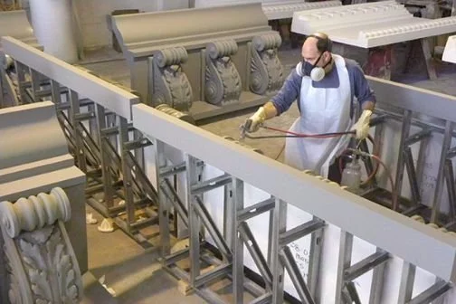 Large scale priming of PGRG cornice elements, final paint by customer after installation.