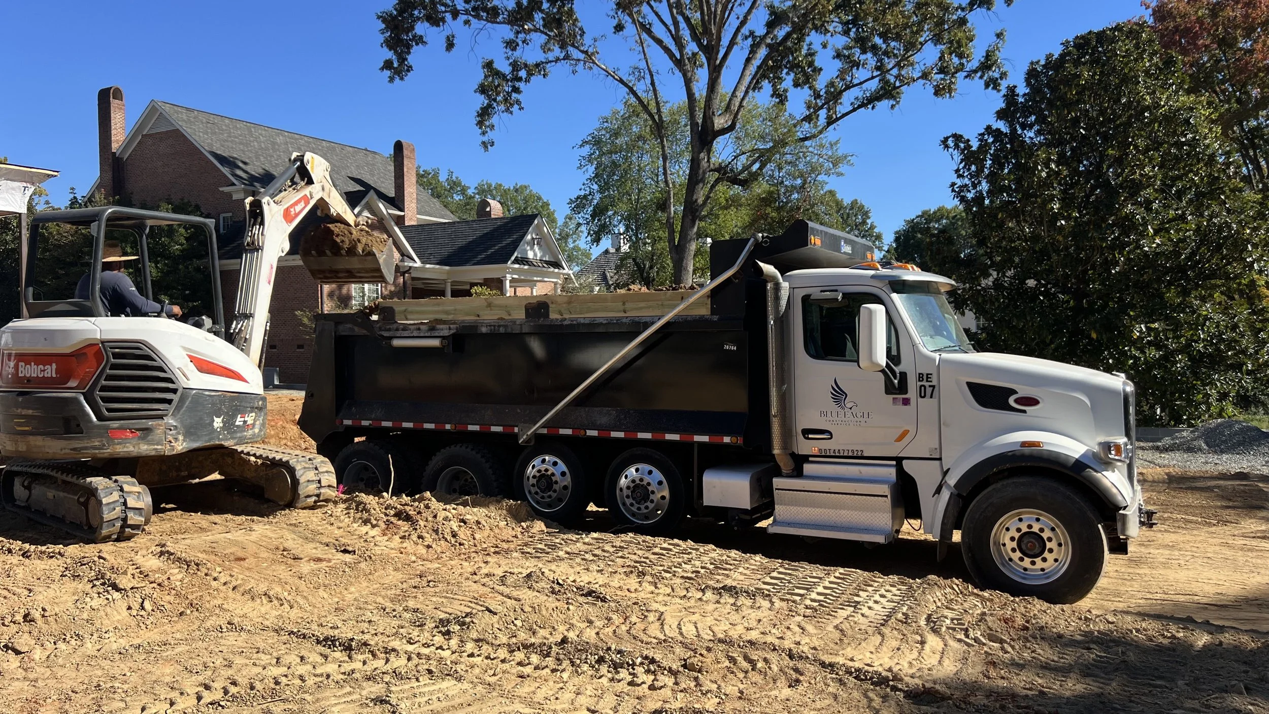 Oranssi technician working on a roof project