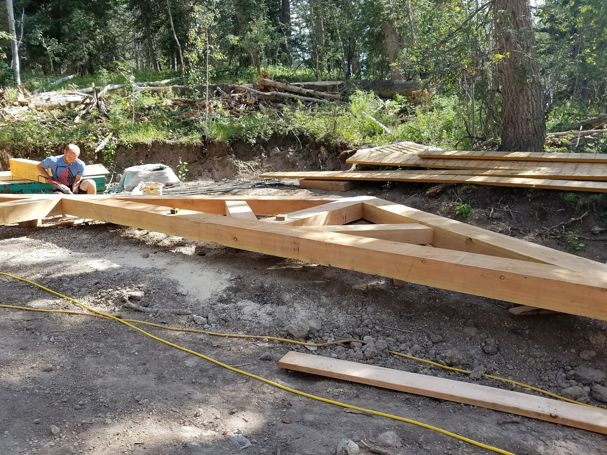 Our team installing timber frames for an outdoor timber frame project.