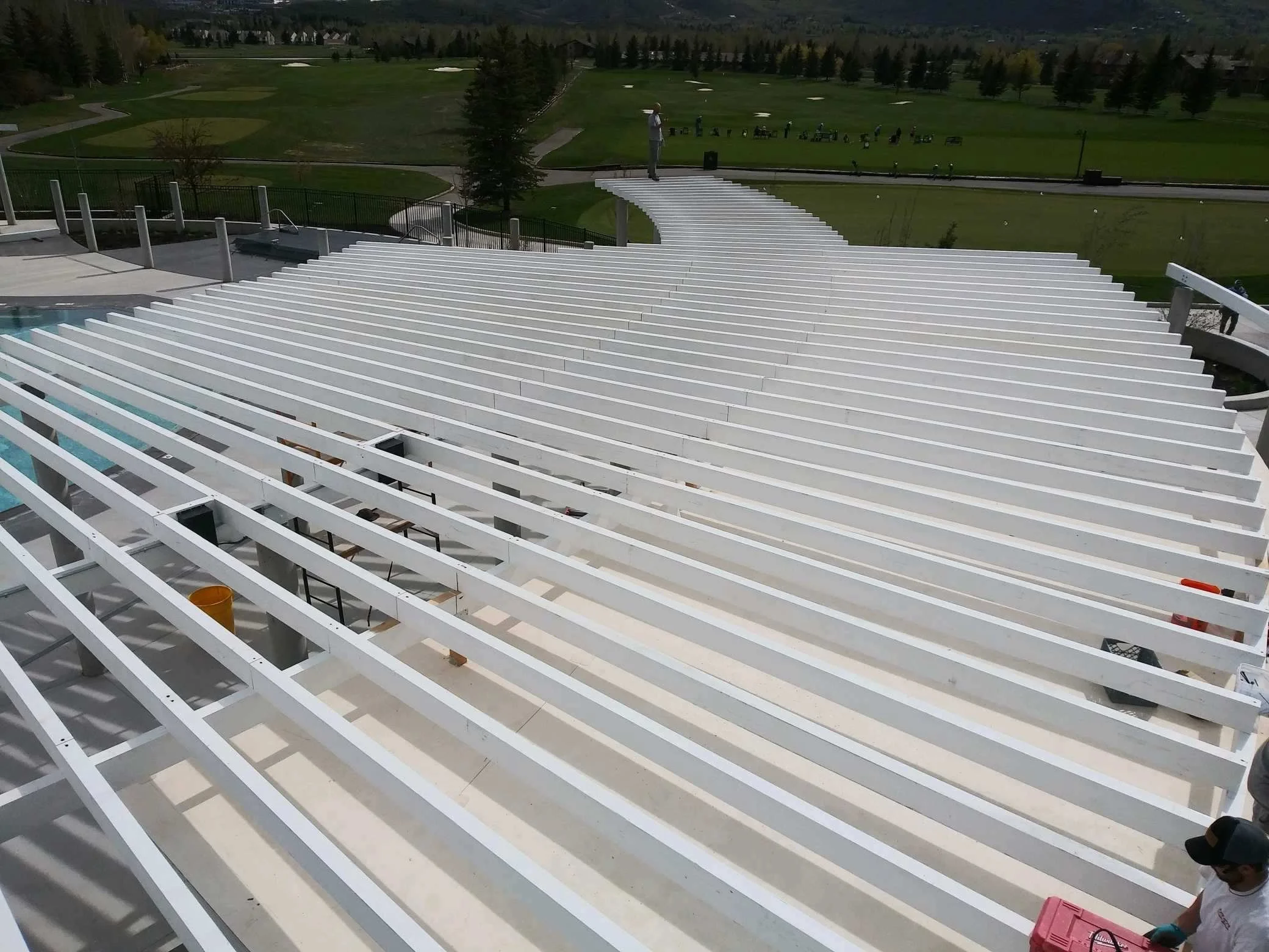 White pergola & steel post install for an apartment complex. 