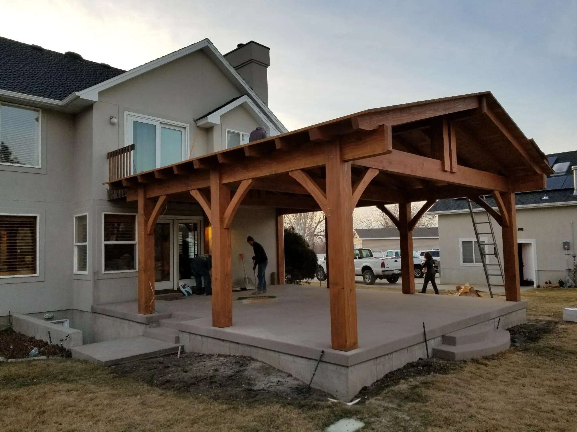 Our team installing a wooden patio pergola in a residential neighborhood.