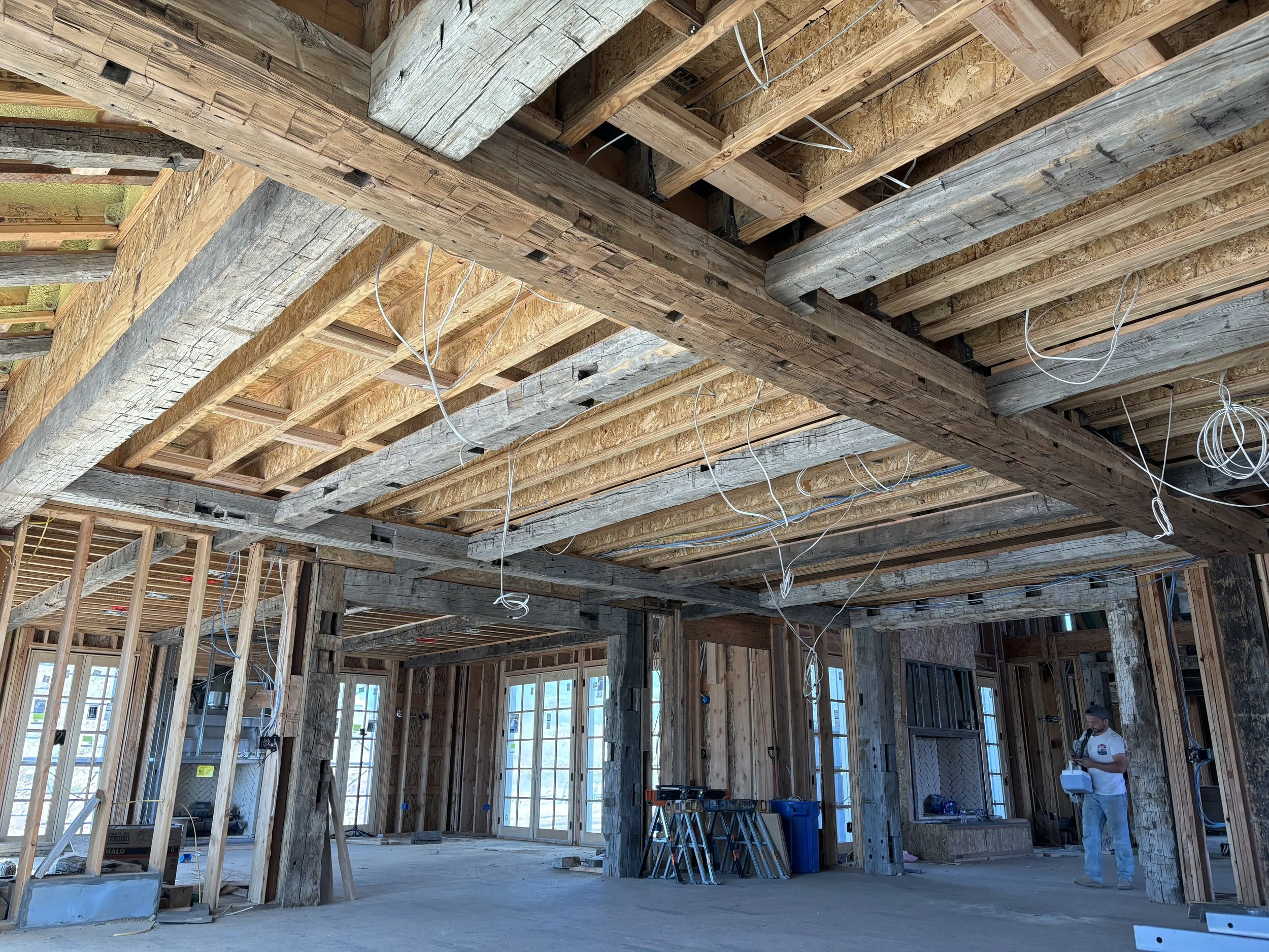 Interior of a house under construction, showing our exposed refurnished timber beams, being used on this project. 