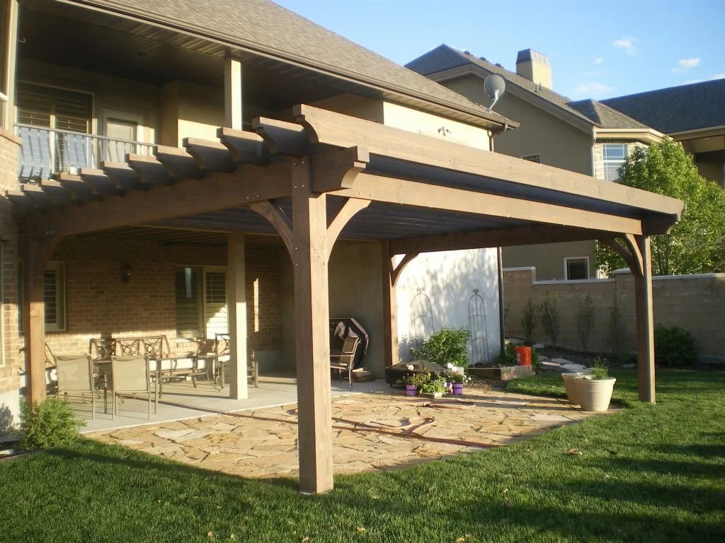  A rustic modern pergola build over the backyard patio.