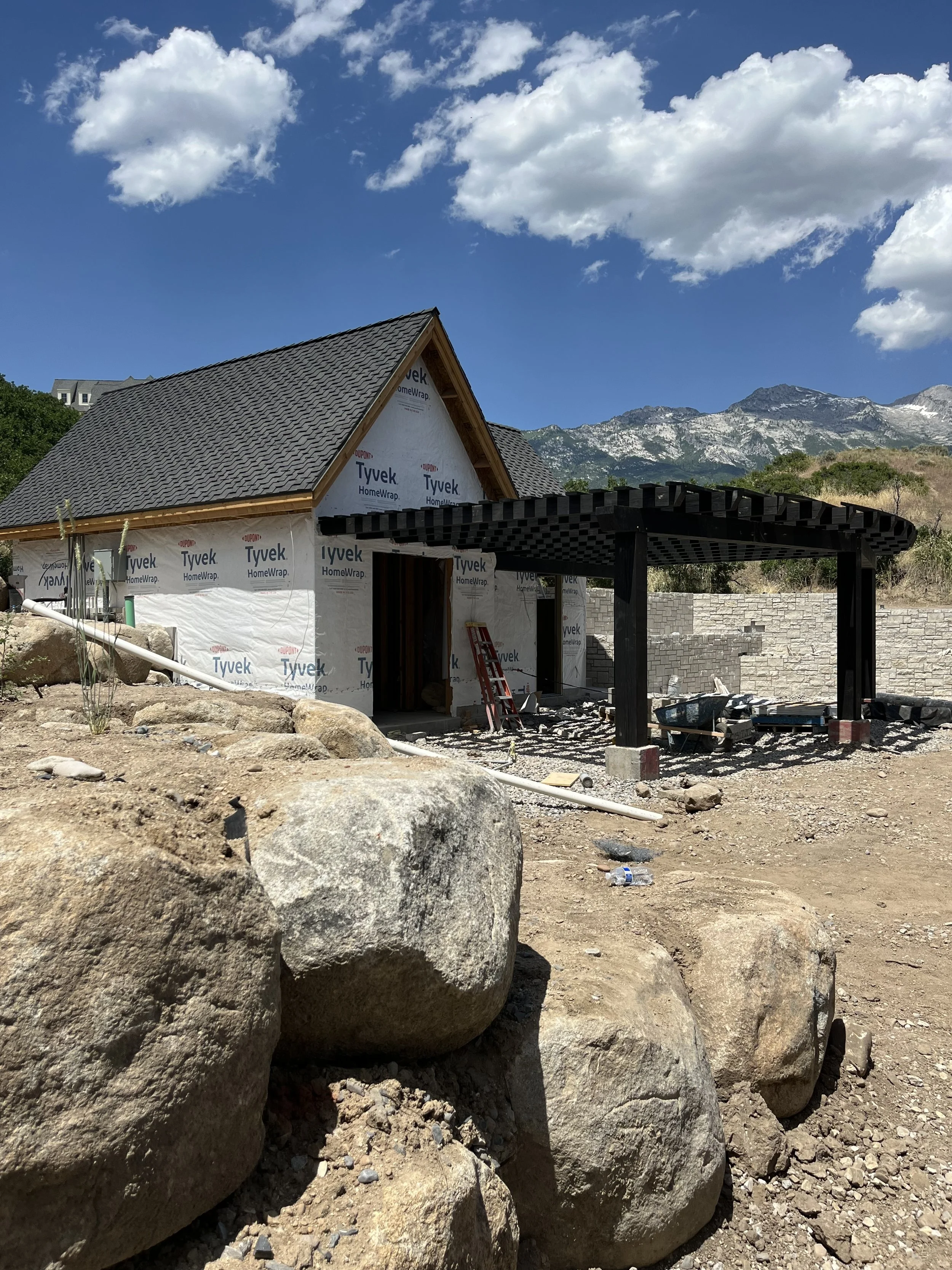  Onsite install of our timber pergola being attached to the garage. 