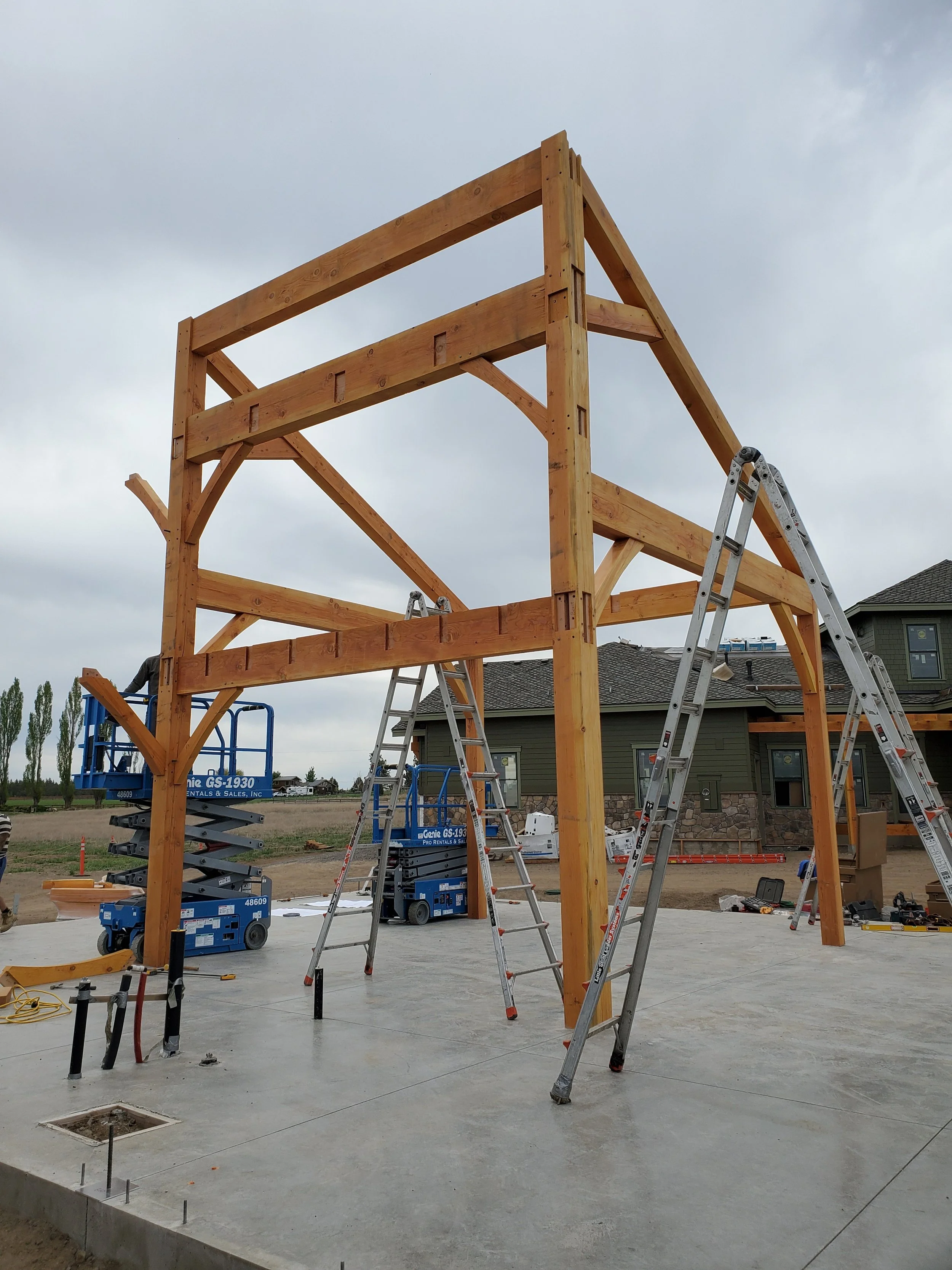 Our team onsite installing timber frame joinery for an outdoor barn site. 