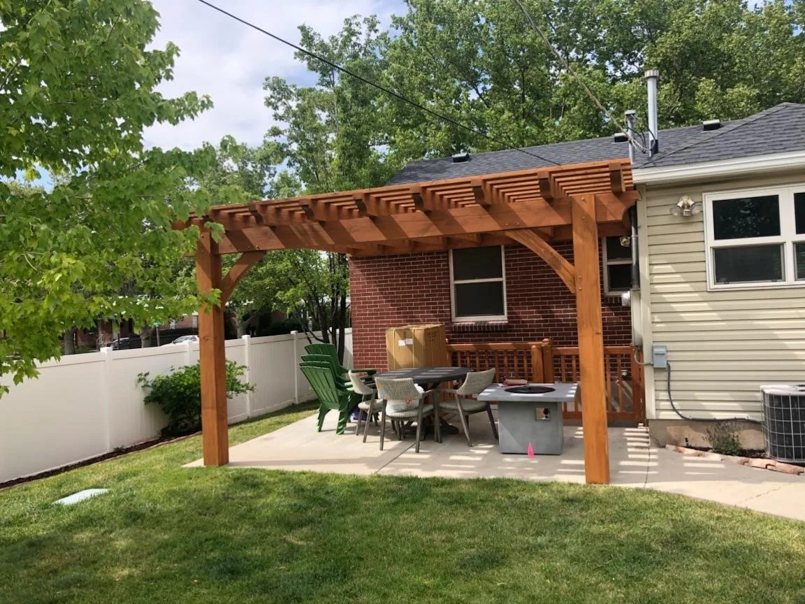 Backyard patio with our timber pergola install. 