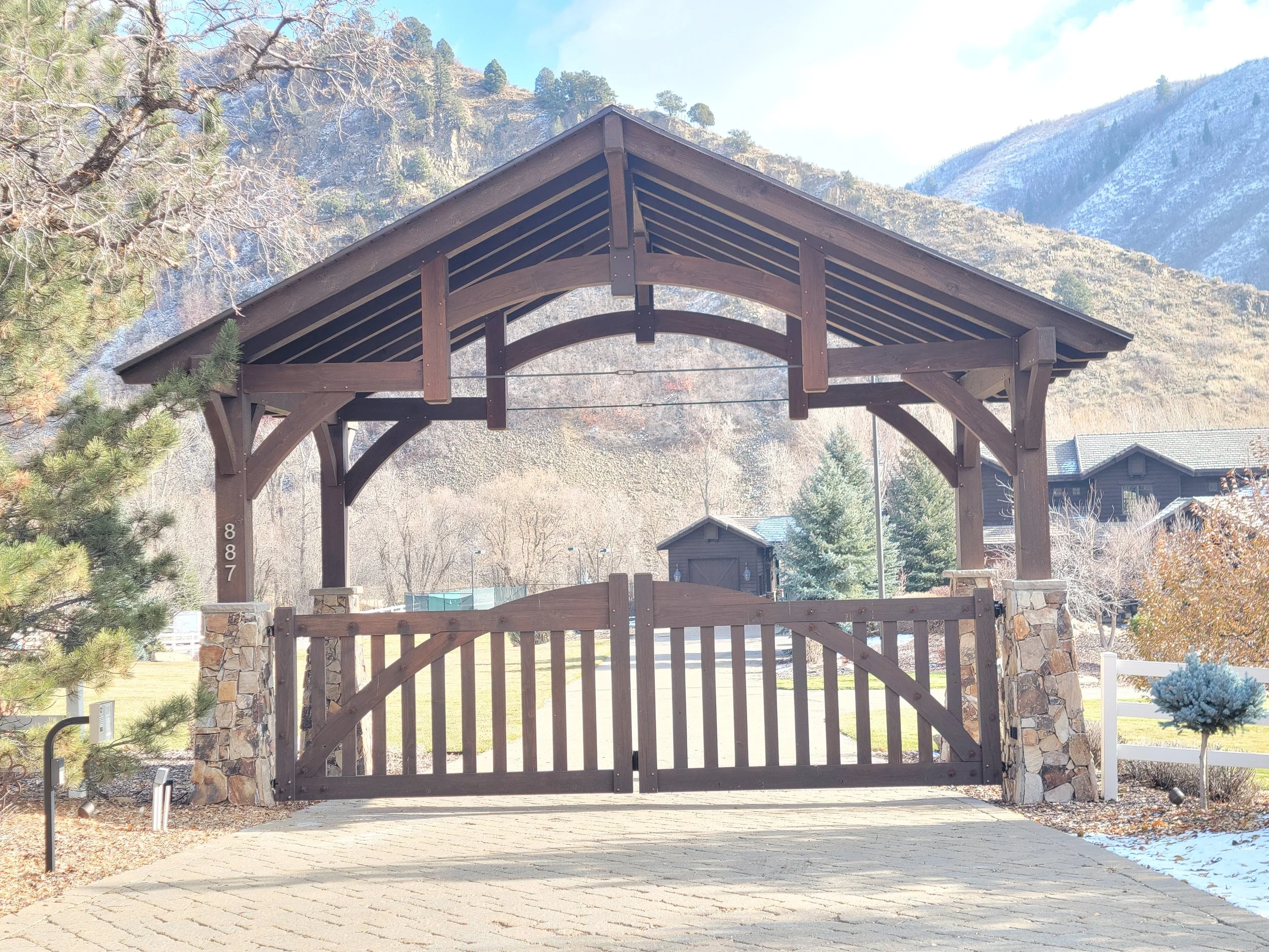 Our timber frame gates attached to the front outdoor timber entrance for an install. 