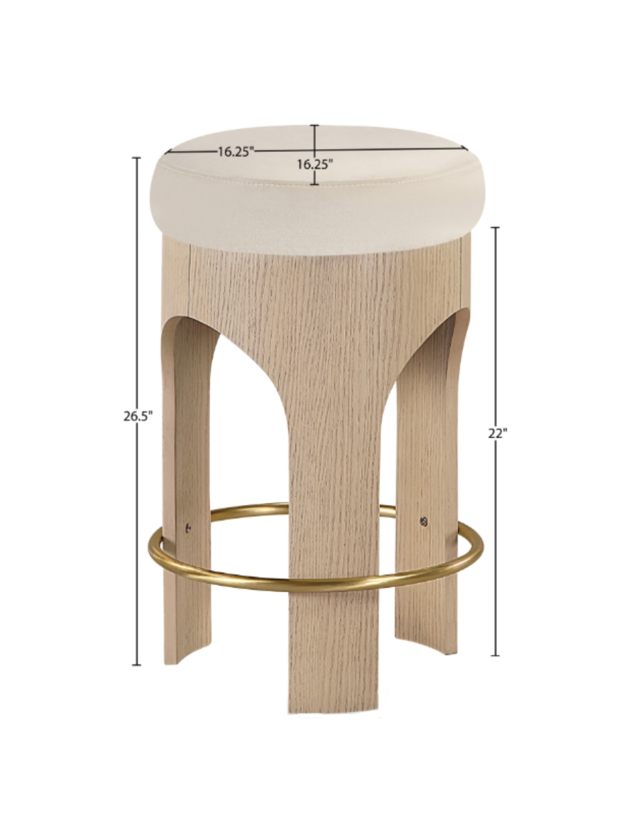 Light wood counter height stool with cream / ivory round velvet upholstered seat and gold foot rest around the entire stool