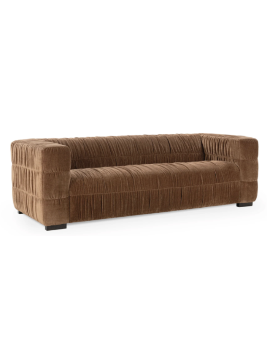 Modern camel brown velvet sofa featuring gathered ruched upholstery, wide square arms, a deep bench seat, and a low-profile silhouette.