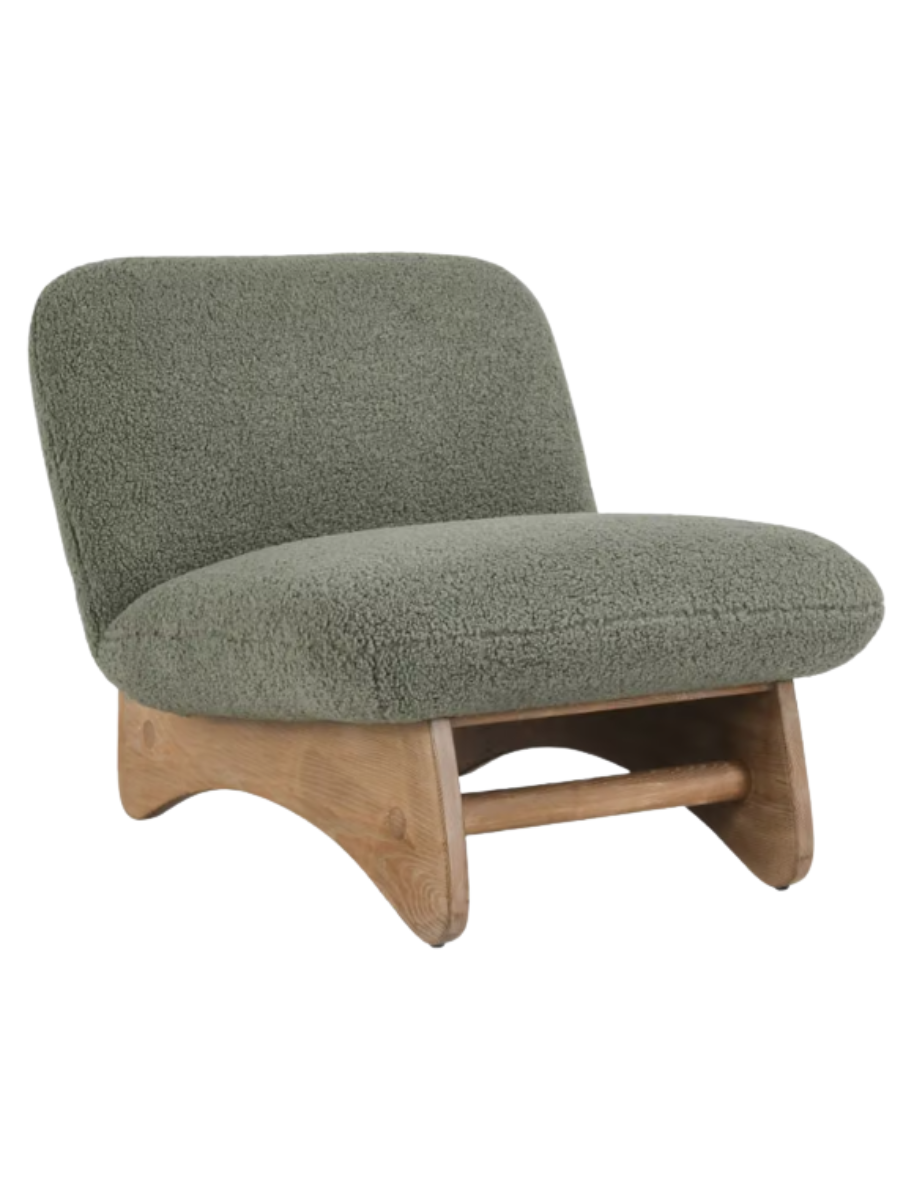 Modern armless accent chair upholstered in sage green bouclé fabric with a curved backrest, wide cushioned seat, and natural wood base.