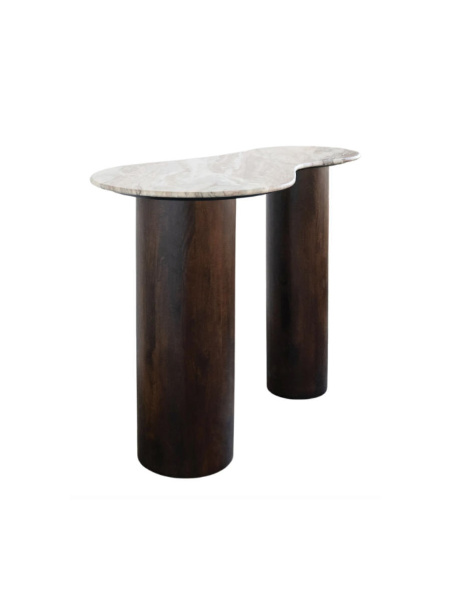 Modern sculptural console table featuring an asymmetrical, organically shaped white marble tabletop with subtle veining and two cylindrical dark wood pedestal legs.