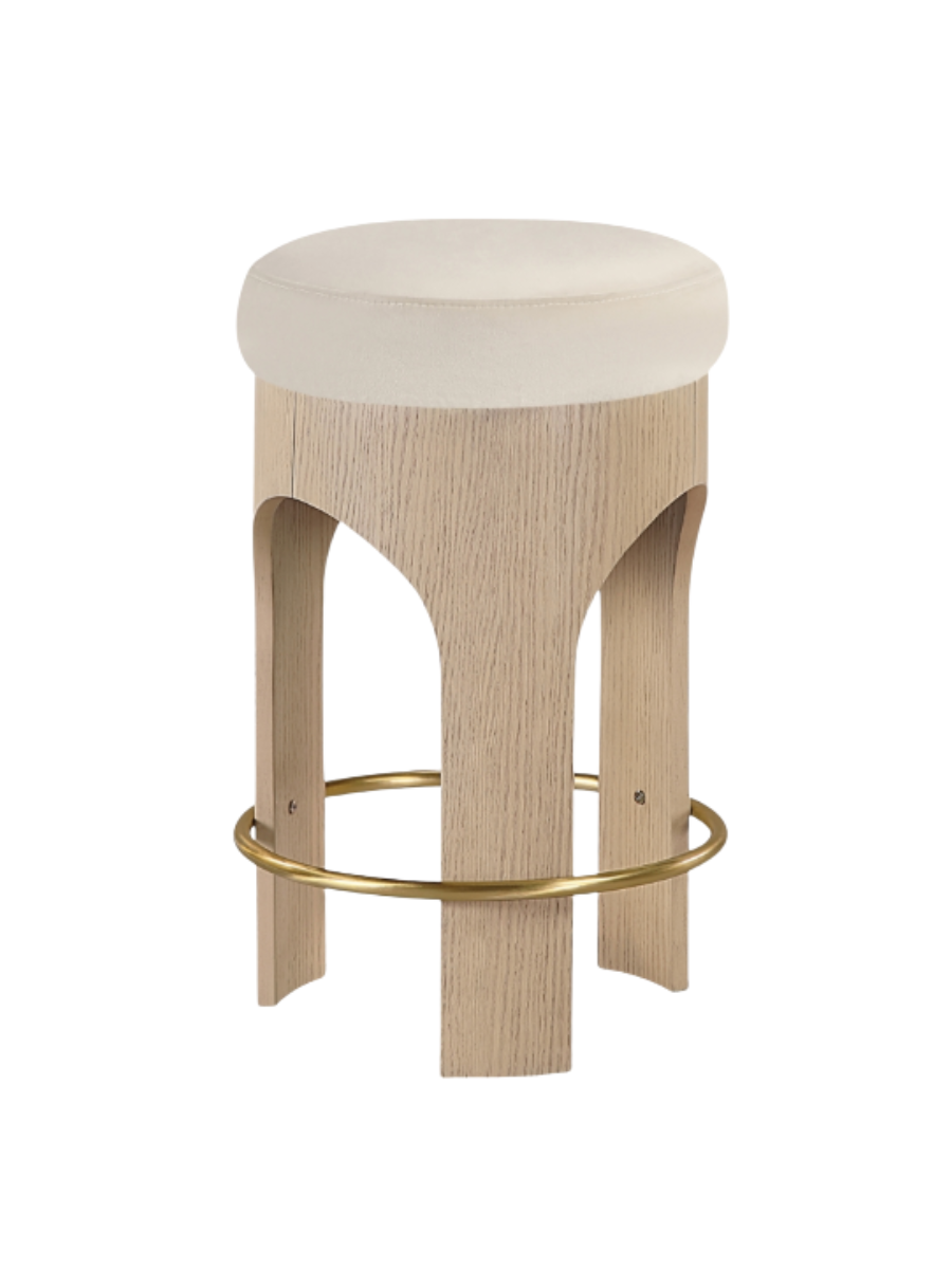 Light wood counter height stool with cream / ivory round velvet upholstered seat and gold foot rest around the entire stool