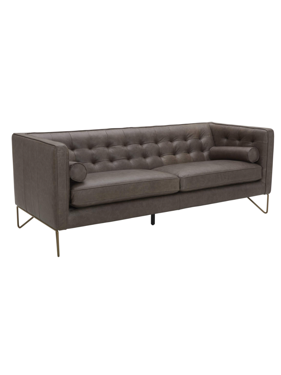 Modern charcoal gray leather sofa featuring a button-tufted backrest, square arms, plush seat cushions, matching cylindrical bolster pillows, and slender metal legs.